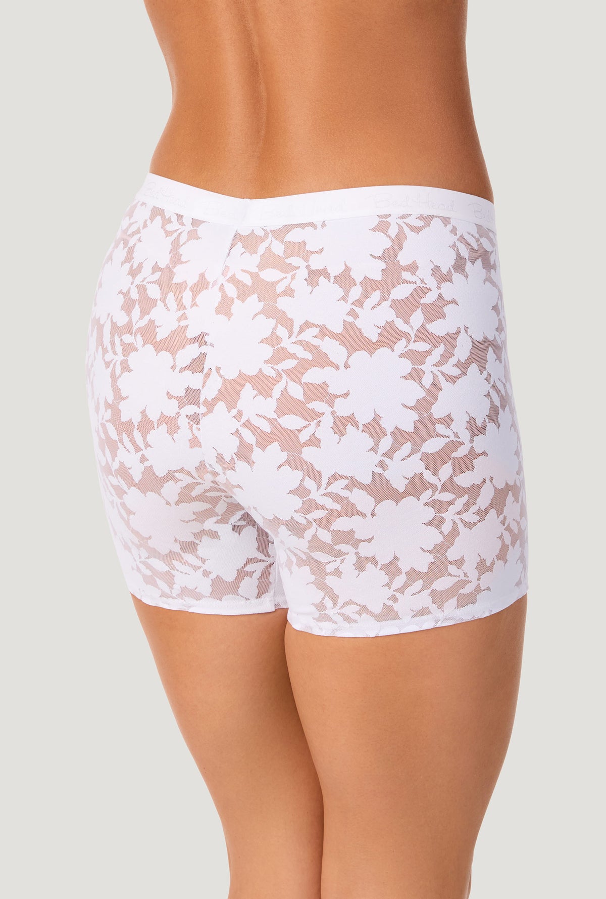 A lady wearing White Stretch Lace Boxer Short Underwear back view