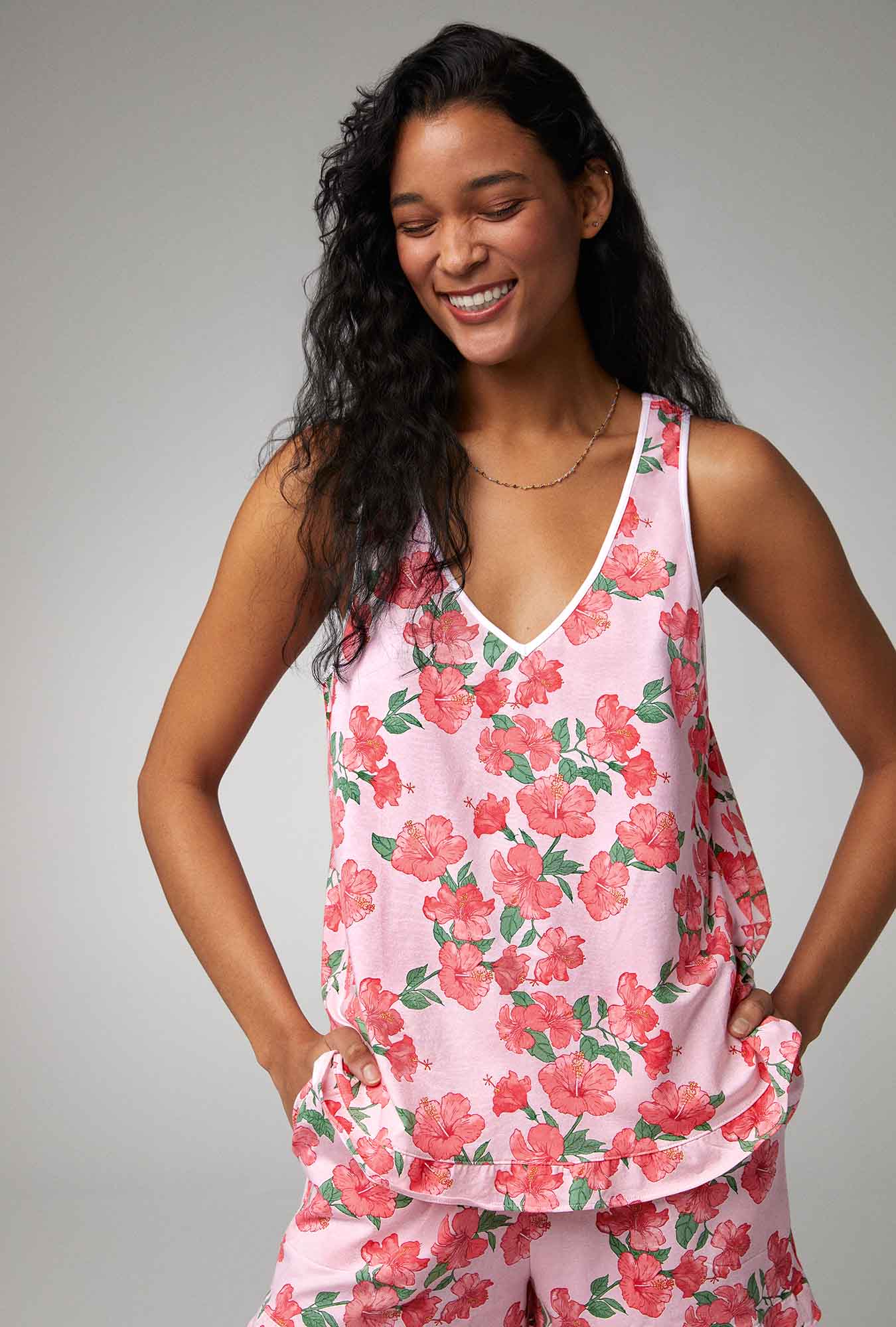 A lady wearing Ruffle Tank Shorty Stretch Jersey PJ Set with Sweet Hibiscus print