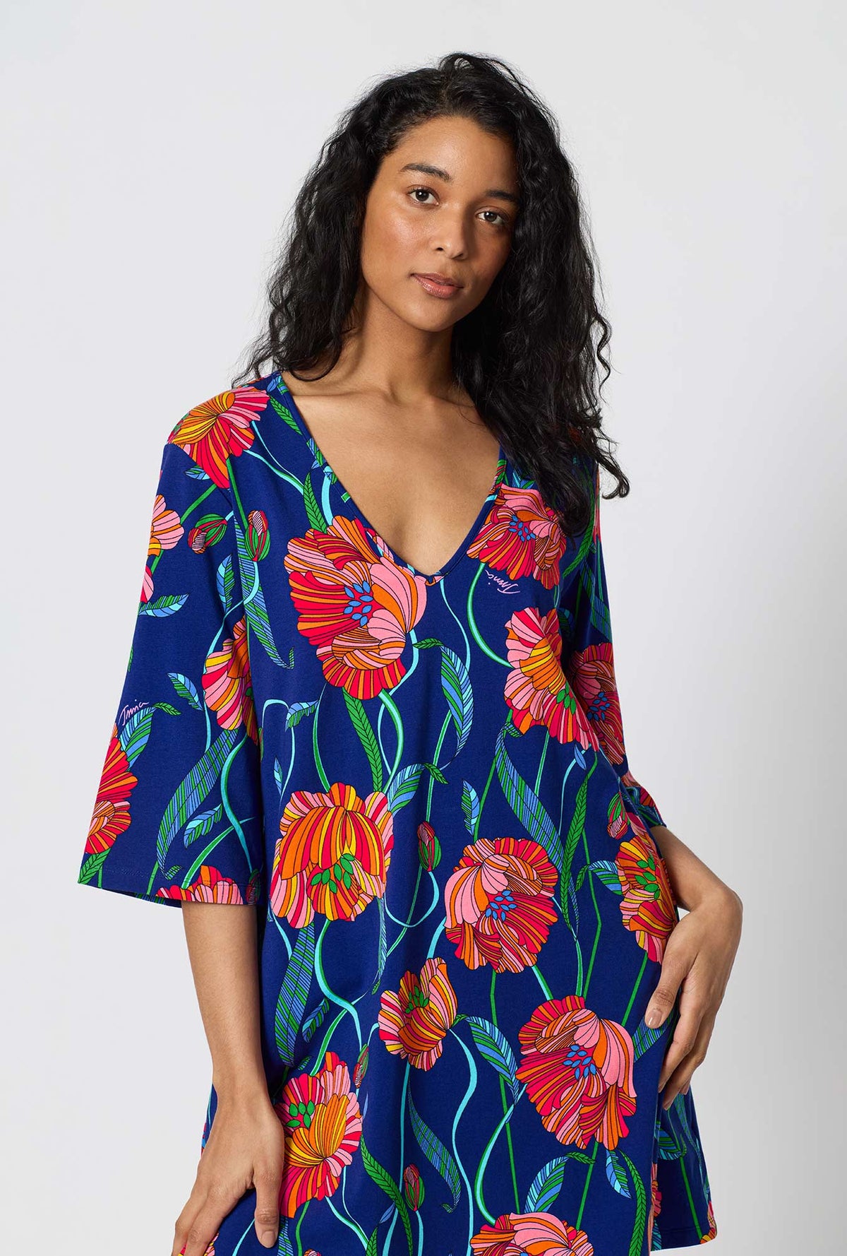 A Lady Wearing BedHead x Trina Turk Linear Poppy Stretch Jersey Sleep Dress in a close up shot