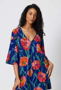 A Lady Wearing BedHead x Trina Turk Linear Poppy Stretch Jersey Sleep Dress in a close up shot