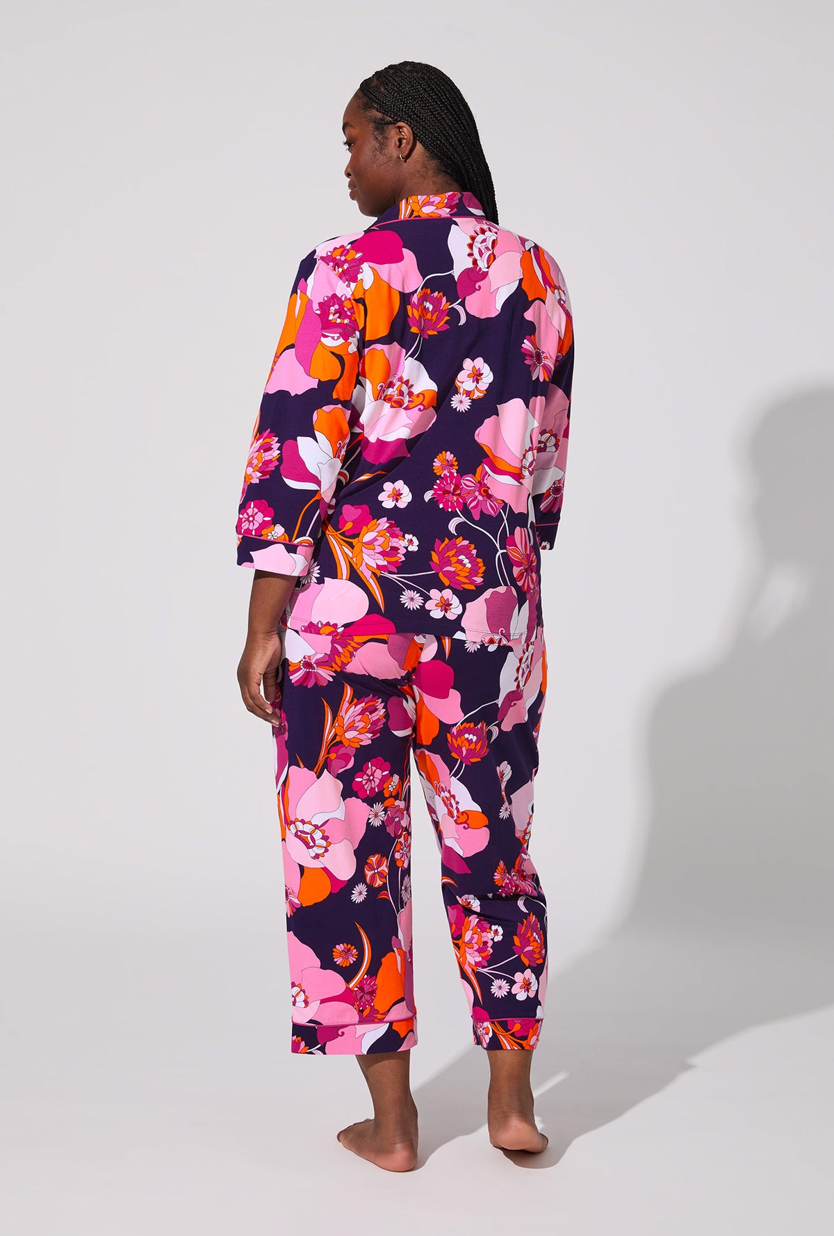 A lady wearing BedHead X Trina Turk Floral Medley 3/4 Sleeve Classic Stretch Jersey Cropped PJ Set