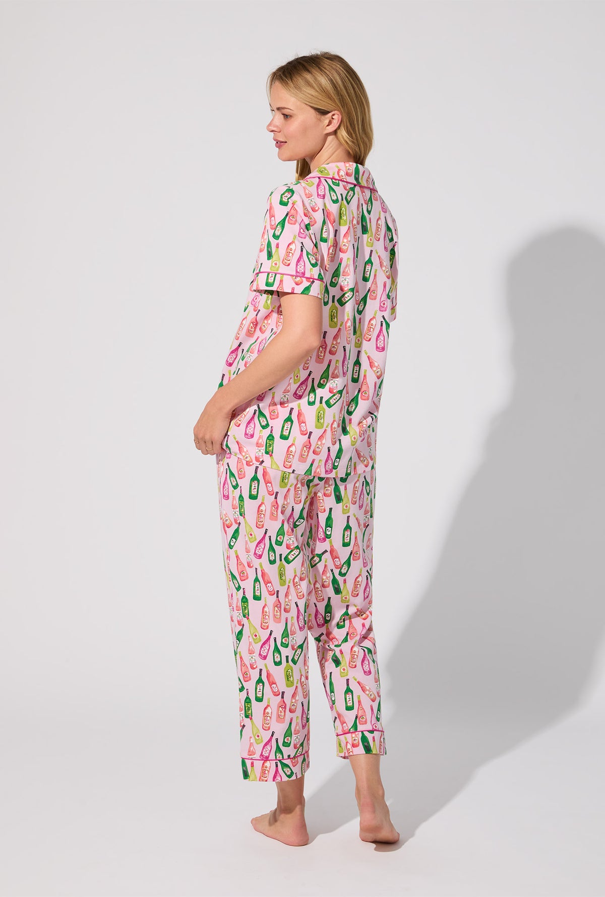 A lady wearing Wine Tour Short Sleeve Classic Stretch Jersey Cropped PJ Set