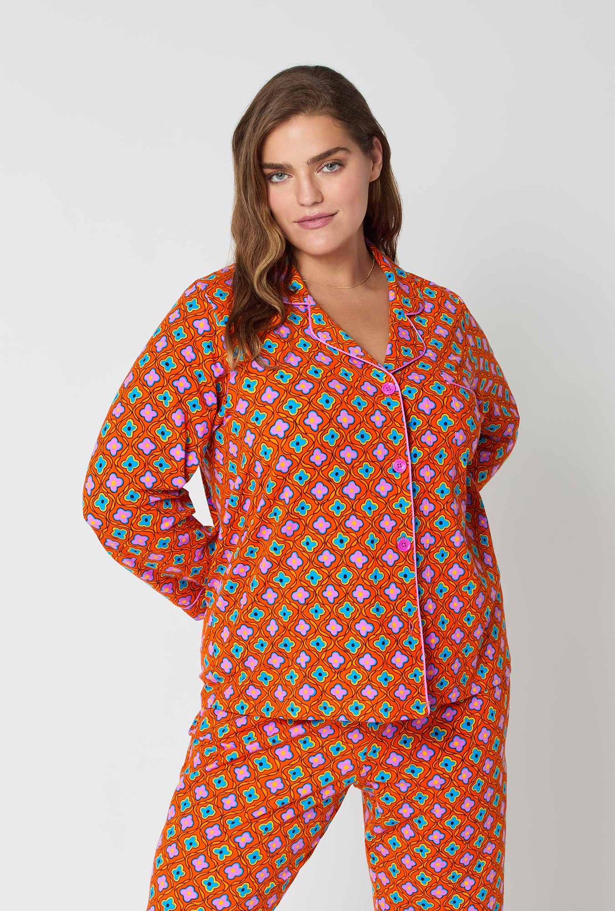 A lady wearing BedHead x Trina Turk Daisy Foulard Long Sleeve Classic Stretch Jersey Pj Set