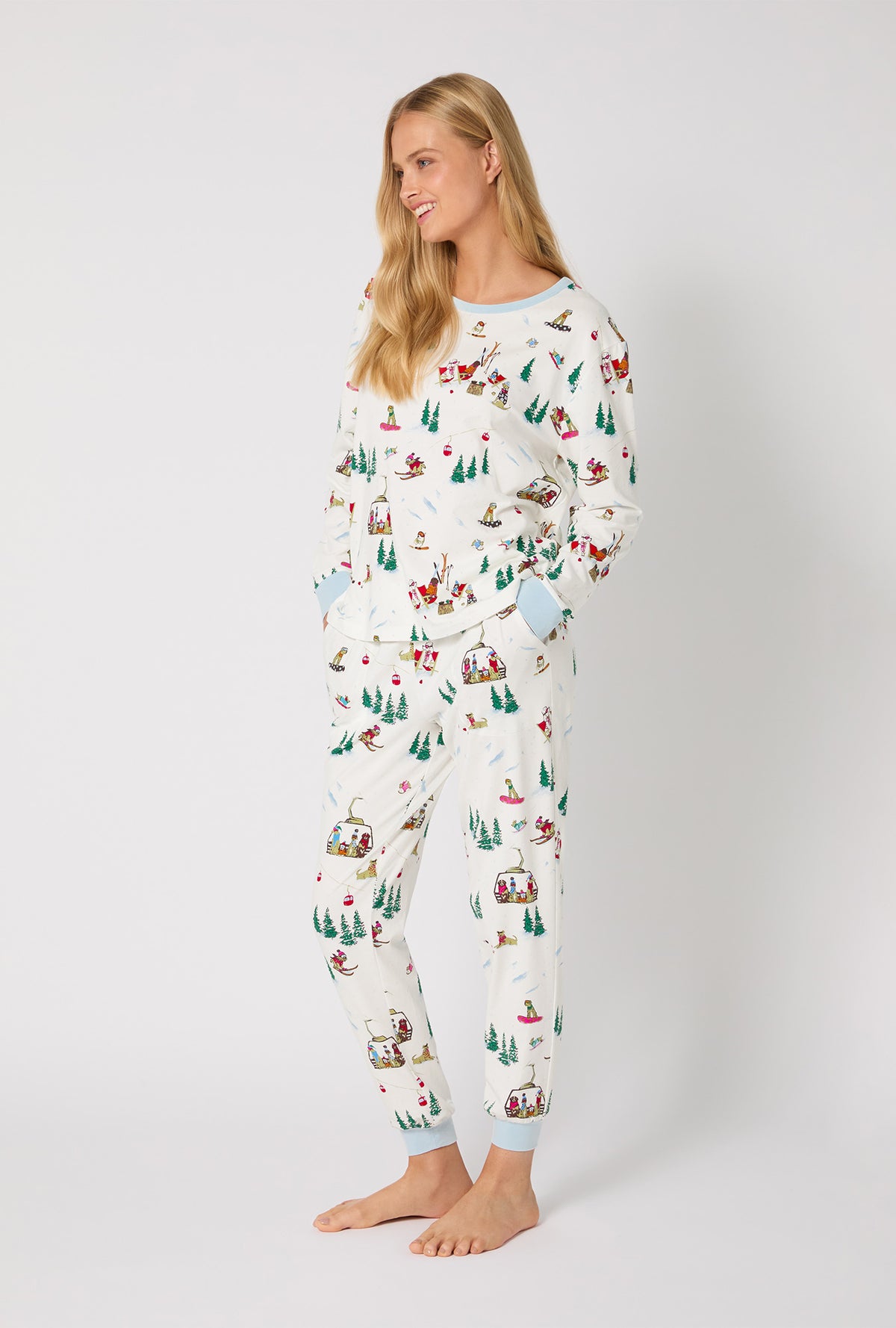 A lady wearing Ski Pups Long Sleeve Pullover Crew And Jogger Stretch Jersey Pj Set