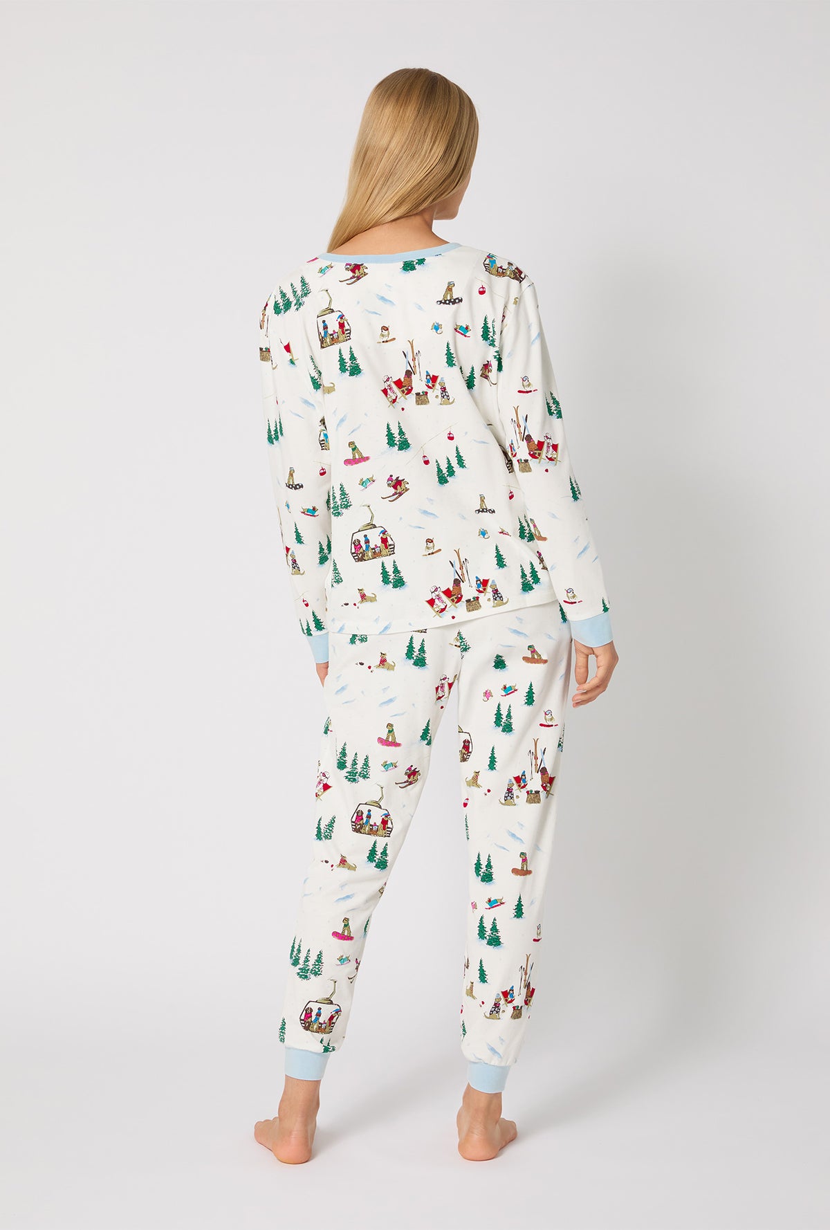 A lady wearing Ski Pups Long Sleeve Pullover Crew And Jogger Stretch Jersey Pj Set