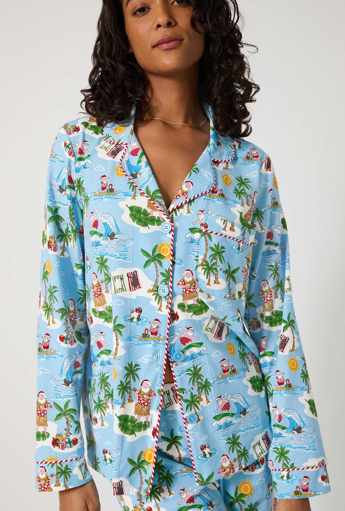 A lady wearing Surfin&#39; Santa Long Sleeve Classic Stretch Jersey Pj Set