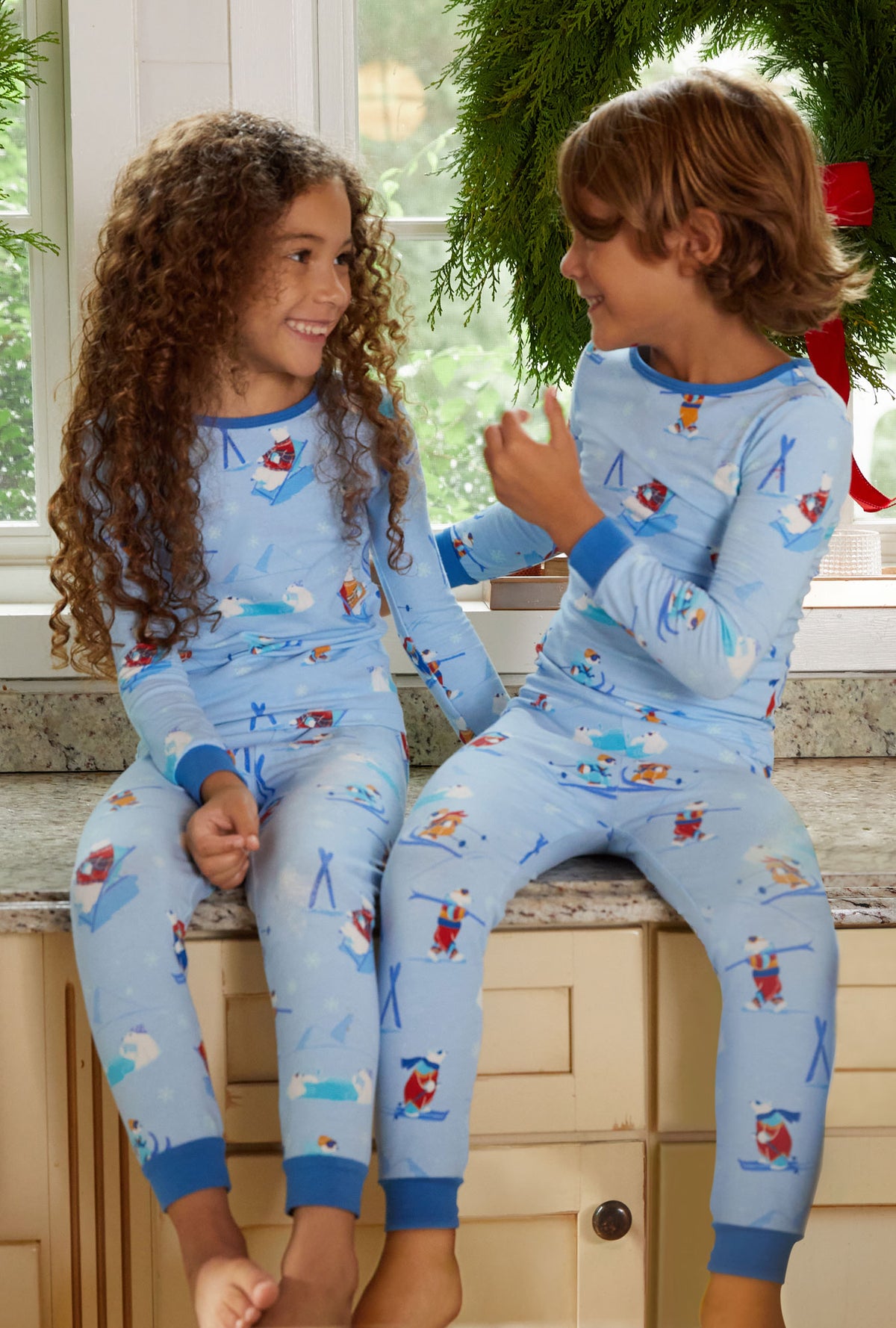 Kids wearing light blue Long Sleeve Stretch Jersey Kids PJ Set with Backcountry Bears print