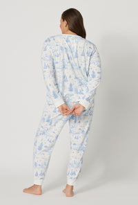 A lady wearing plus size Winter Wonderland Long Sleeve Pullover Crew And Jogger Stretch Jersey Pj Set back view