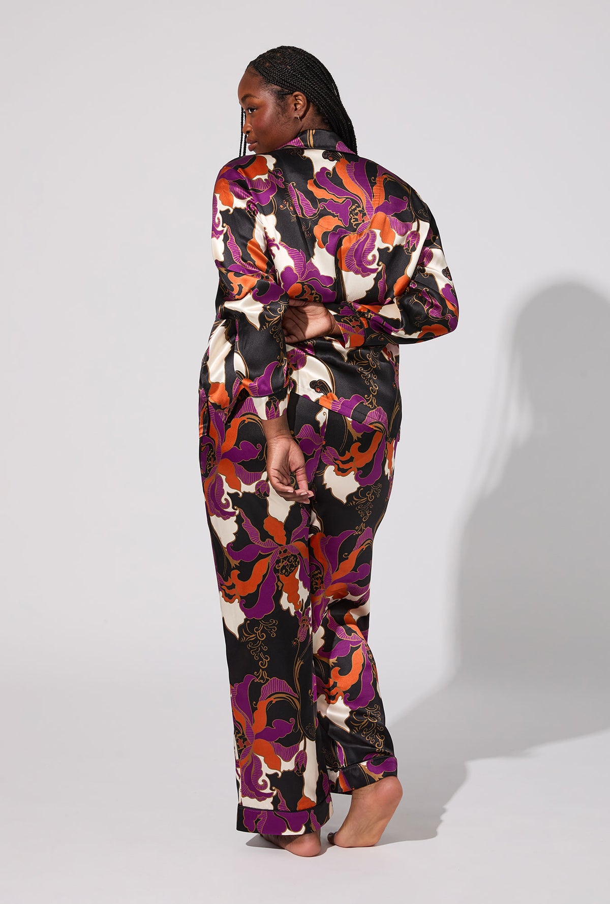A lady wearing BedHead X Trina Turk Fall Floral Long Sleeve Classic Washable Silk PJ Set