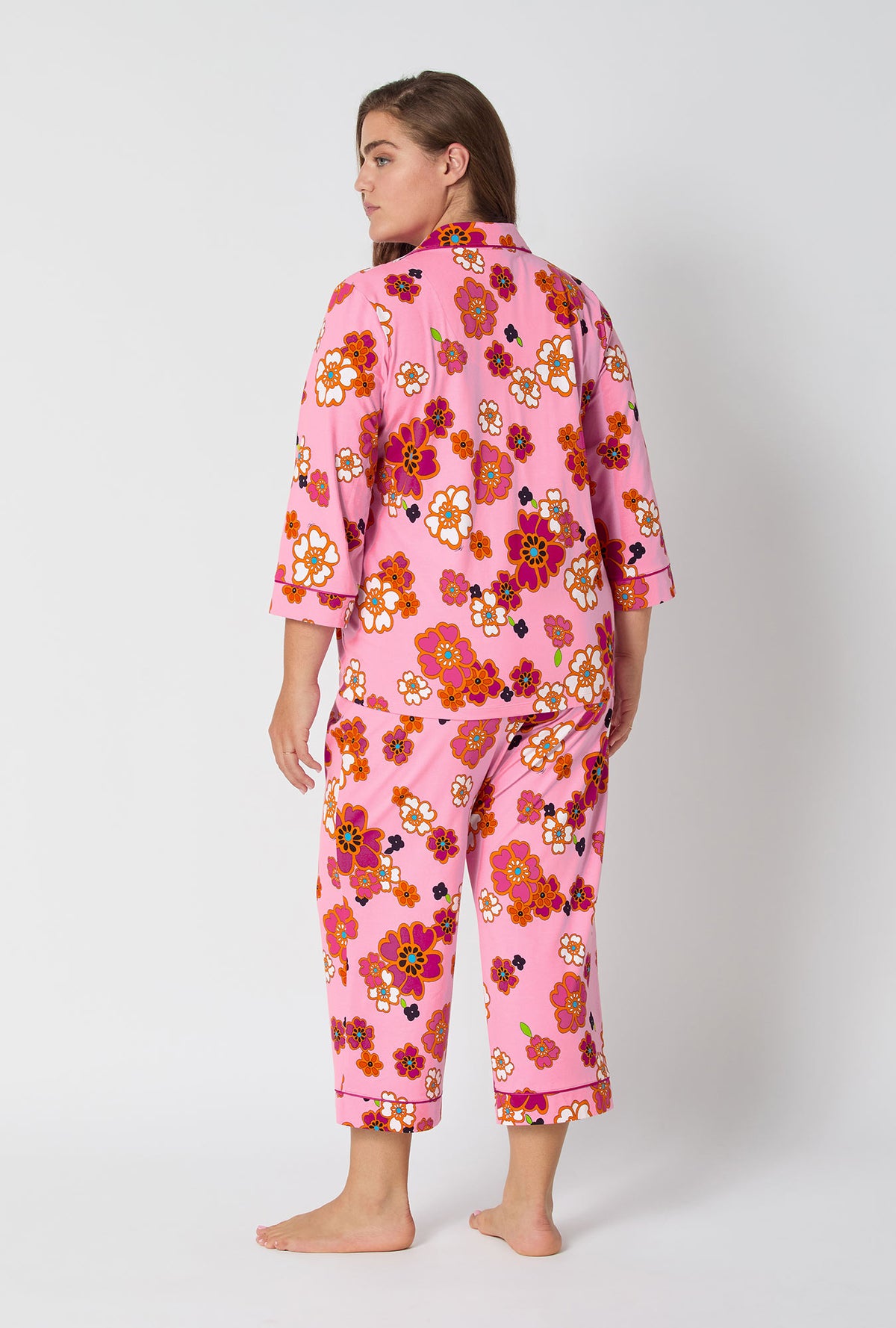 A lady wearing BedHead x Trina Turk Resort Floral 3/4 Sleeve Classic Stretch Jersey Cropped Pj Set
