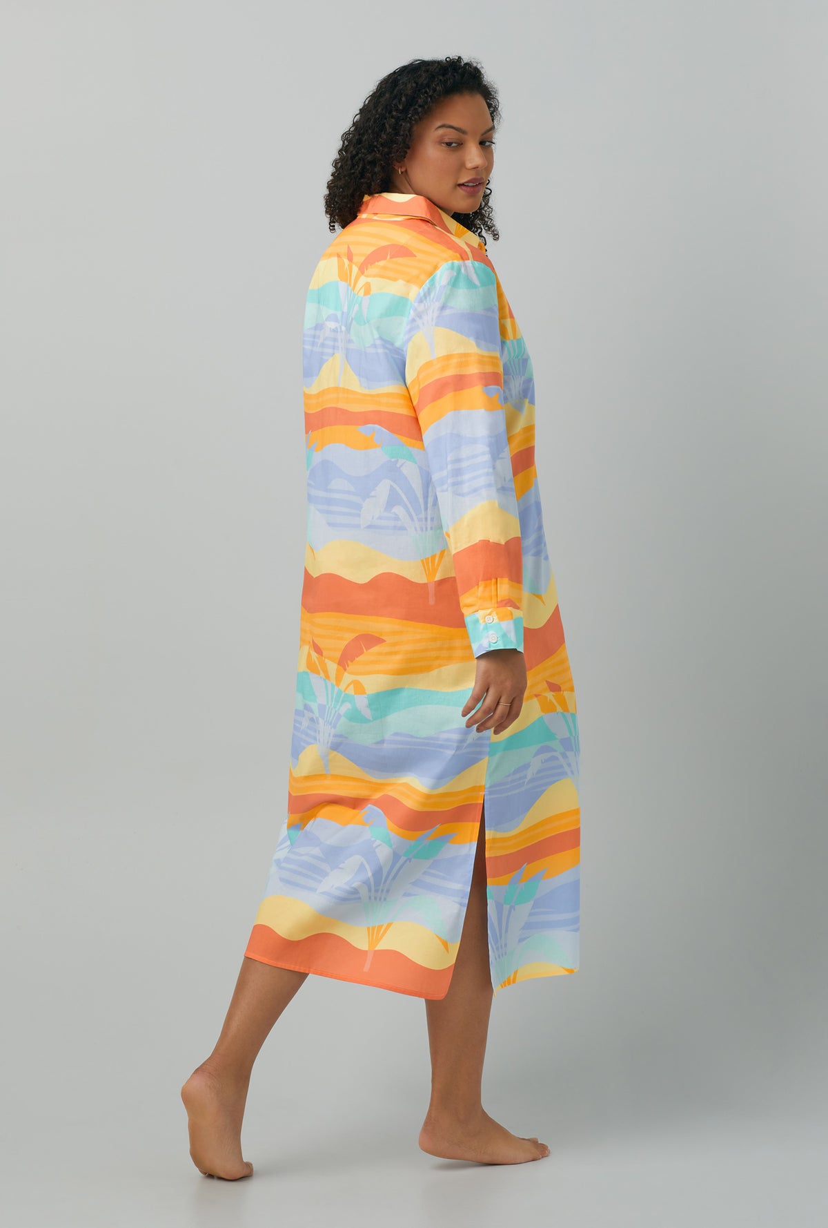 A lady wearing plus size multi color Long Sleeve Maxi Collared Woven Cotton Poplin Sleepshirt with Desert Palms print
