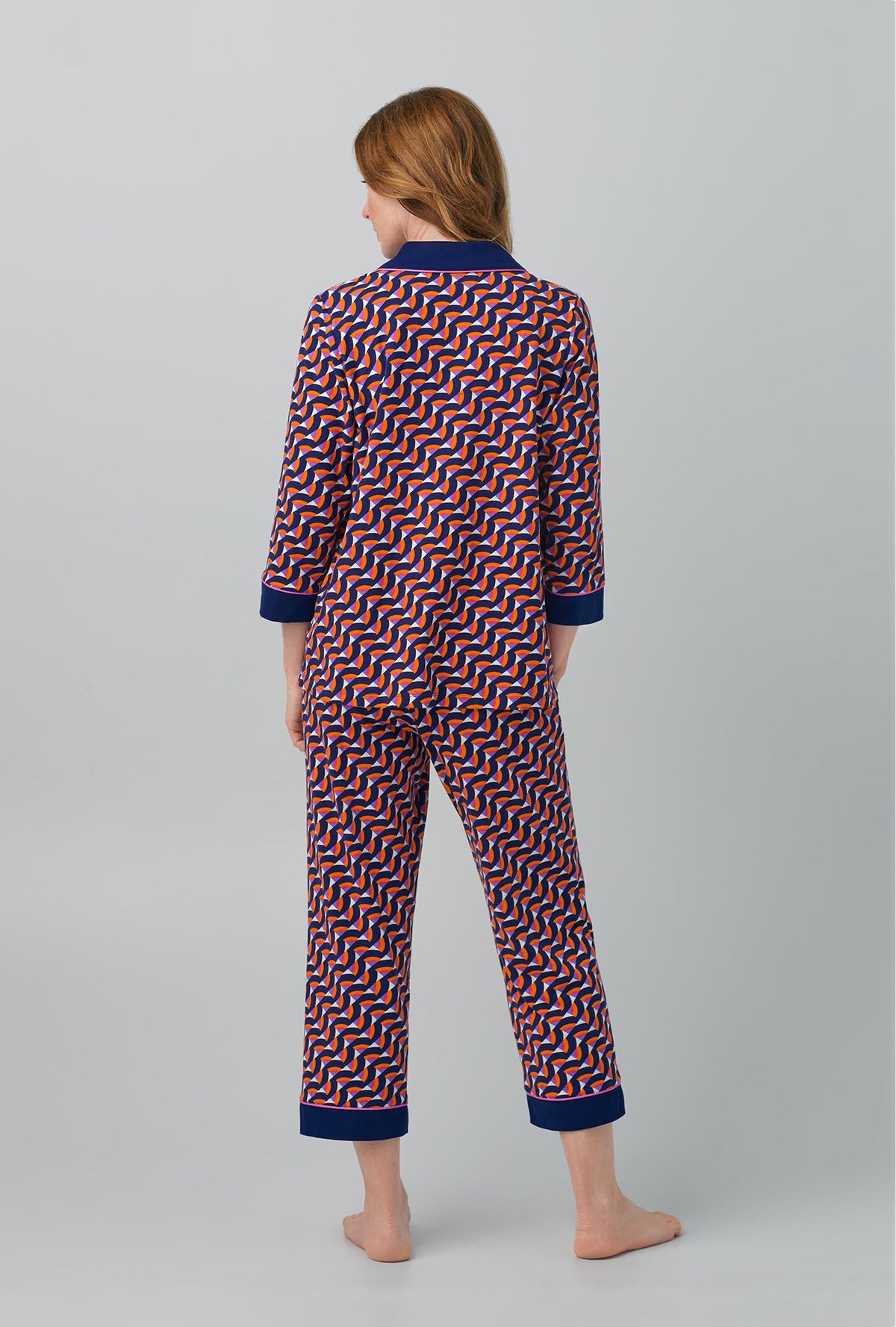 A lady wearing Geo Rainbow 3/4 Sleeve Classic Stretch Jersey PJ Set