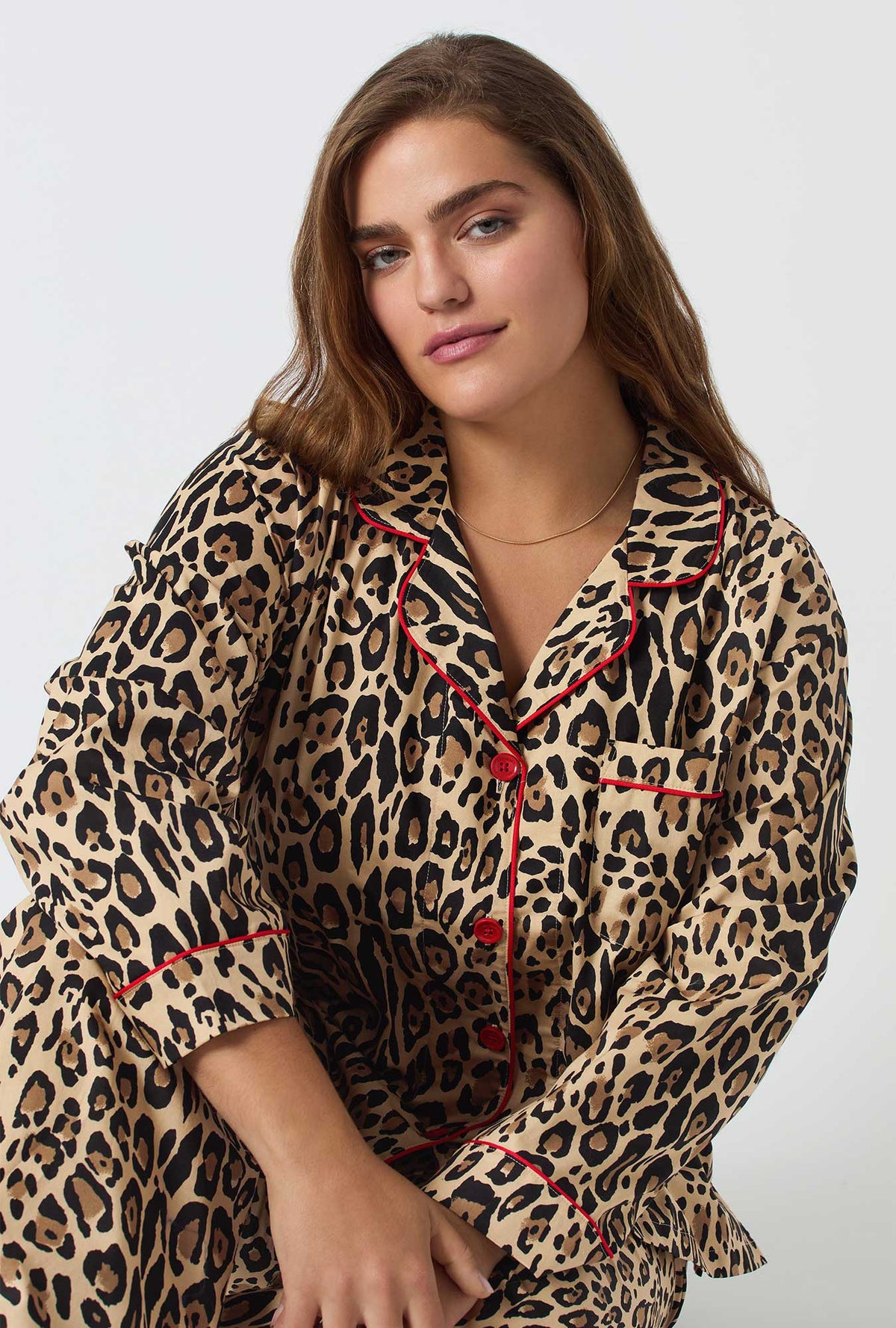 A lady wearing BedHead X Trina Turk Jaguar Stripe Long Sleeve Classic Woven Cotton Poplin Pj Set