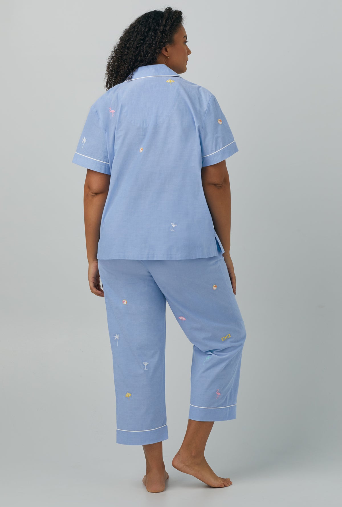 A lady wearing plus size blue Short Sleeve Classic Woven Cotton Poplin Cropped PJ Set with Chambray print
