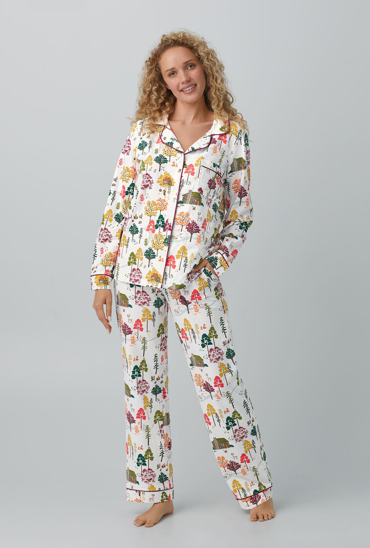 A lady wearing white Long Sleeve Classic Stretch Jersey PJ Set with Forest Retreat print