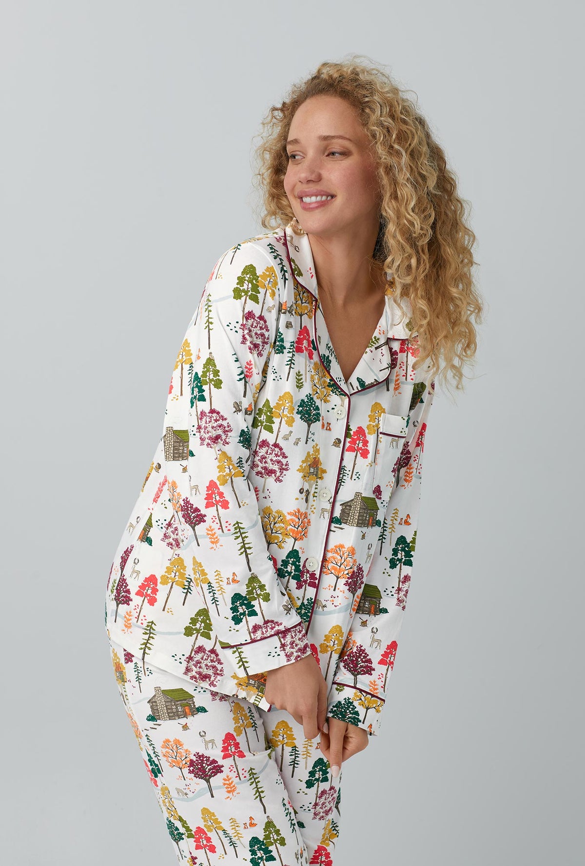 A lady wearing white Long Sleeve Classic Stretch Jersey PJ Set with Forest Retreat print