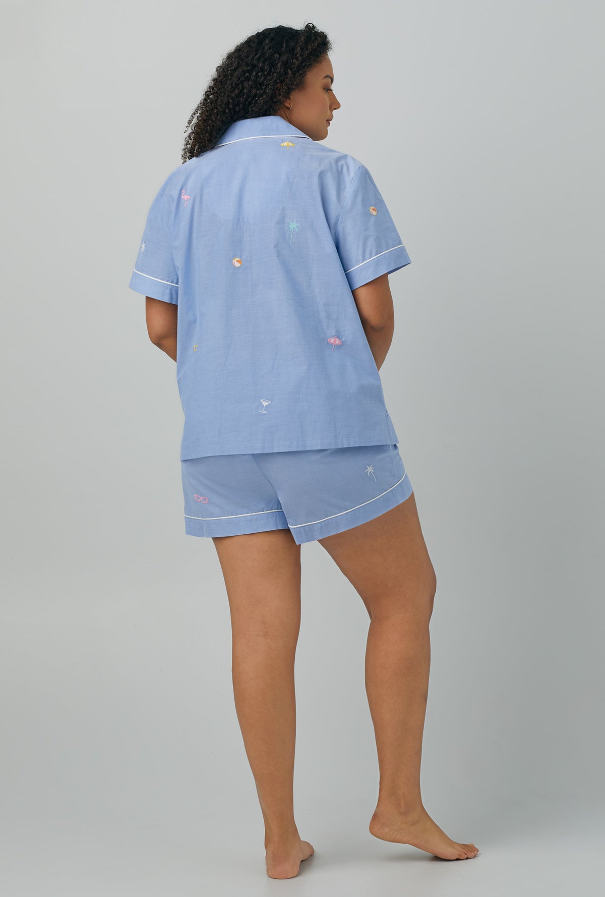 A lady wearing plus size blue Short Sleeve Classic Woven Cotton Poplin Shorty PJ Set with Chambray print