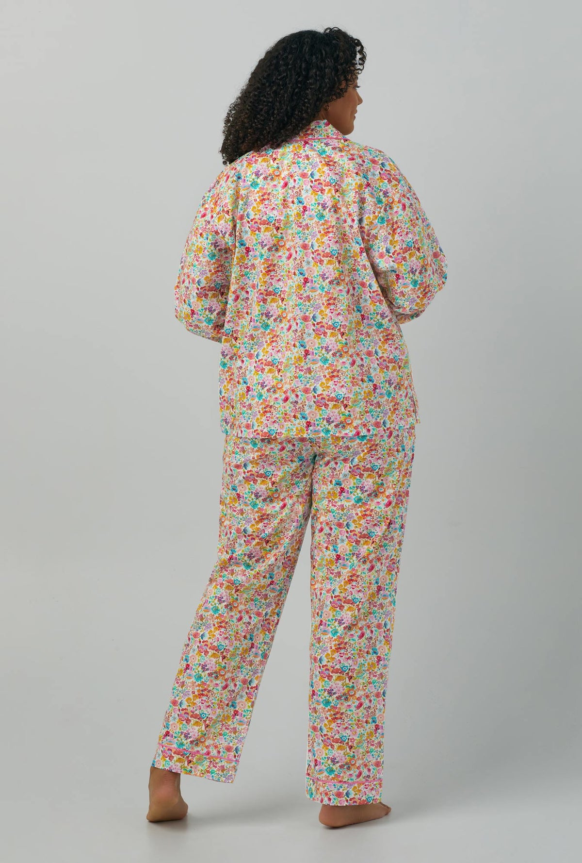A lady wearing plus size Long Sleeve Classic Woven Cotton PJ Set with Classic Meadow print