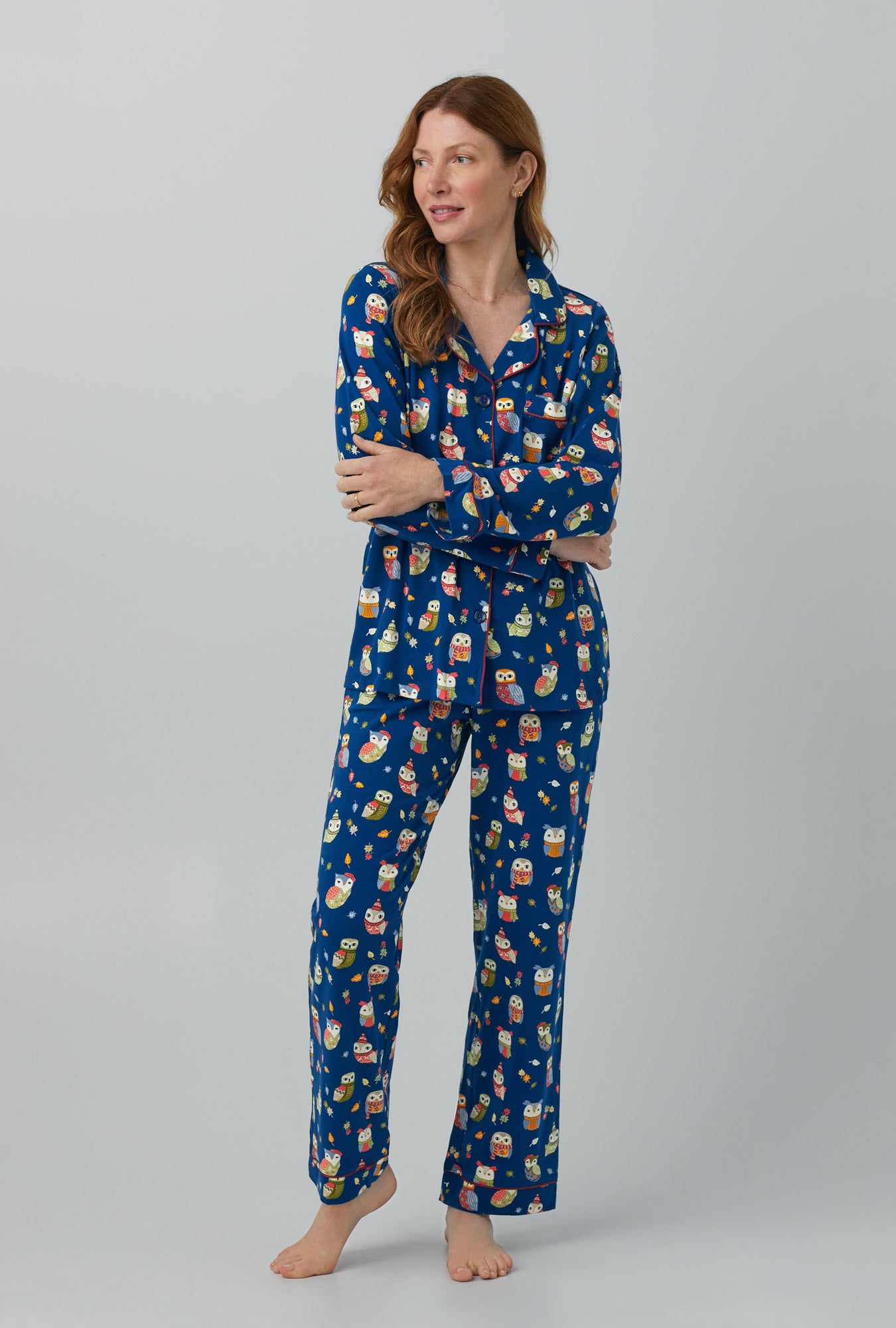 A lady wearing Long Sleeve Classic Stretch Jersey PJ Set with autumn owls print
