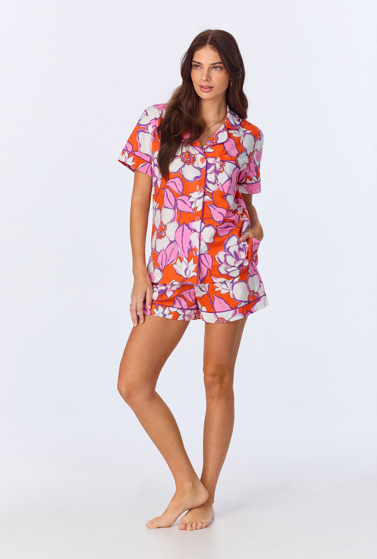 A lady wearing BedHead x Trina Turk Gardenia Short Sleeve Classic Woven Cotton Poplin Shorty PJ Set