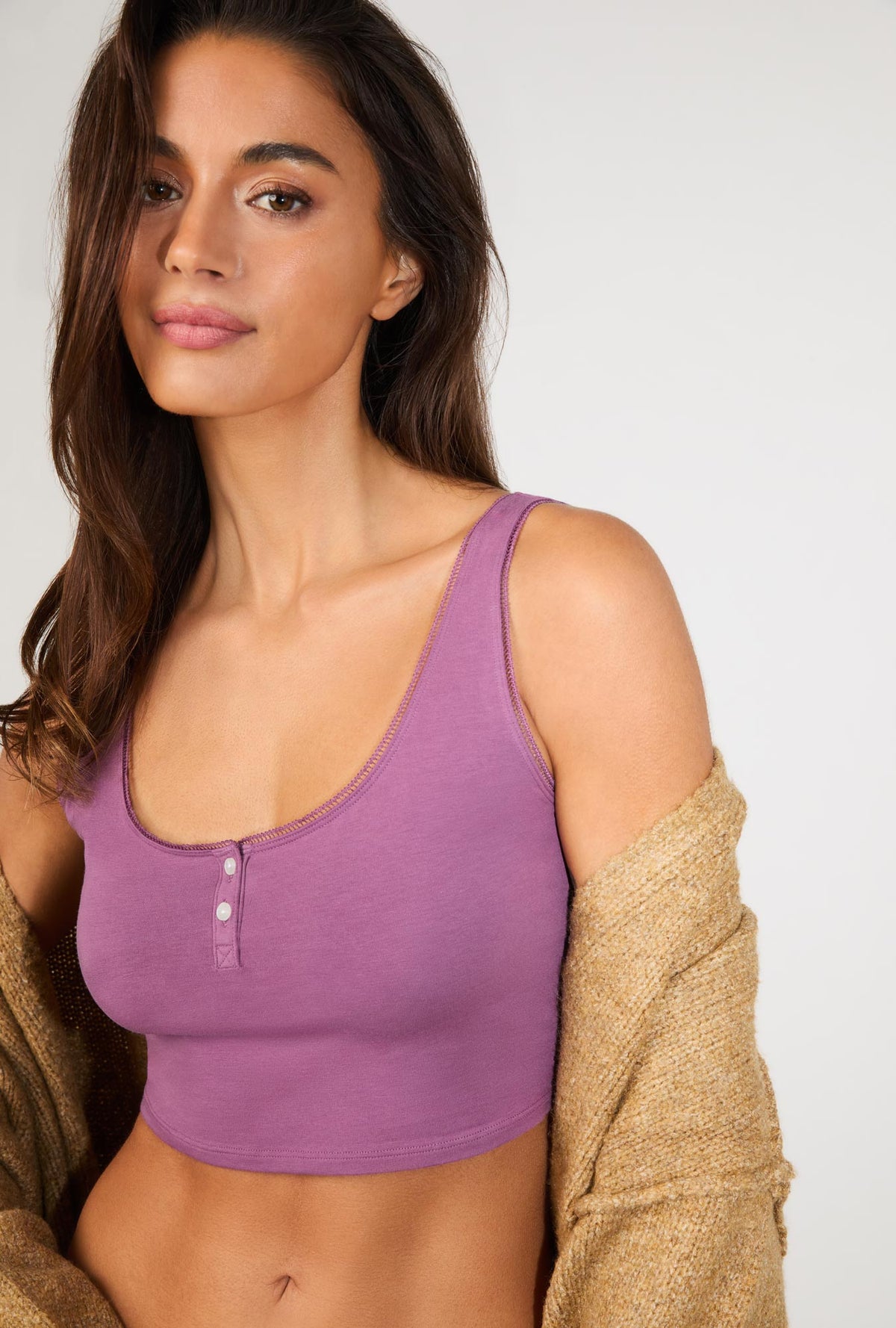 A lady wearing Berry Stretch Jersey Crop Tank