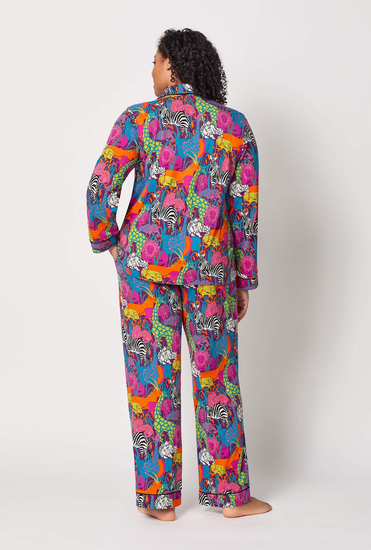A lady wearing plus size BedHead x Trina Turk Jungle Long Sleeve Classic Stretch Jersey Pj Set