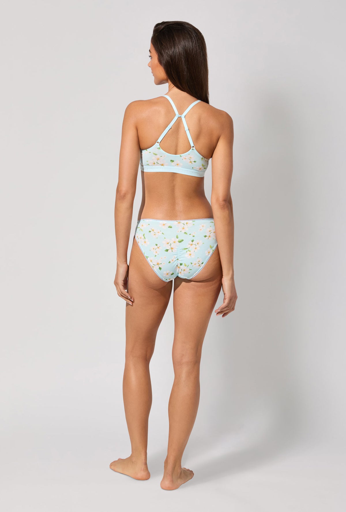 A lady wearing Magnolia Breeze Stretch Jersey Bralette