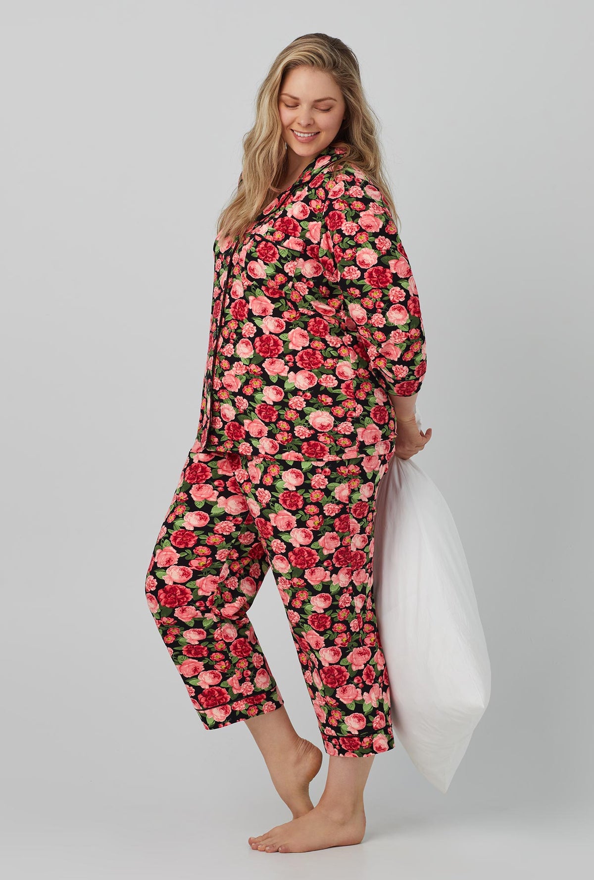 A lady wearing 3/4 Sleeve Classic Stretch Jersey Cropped PJ Set with Roses are Red print