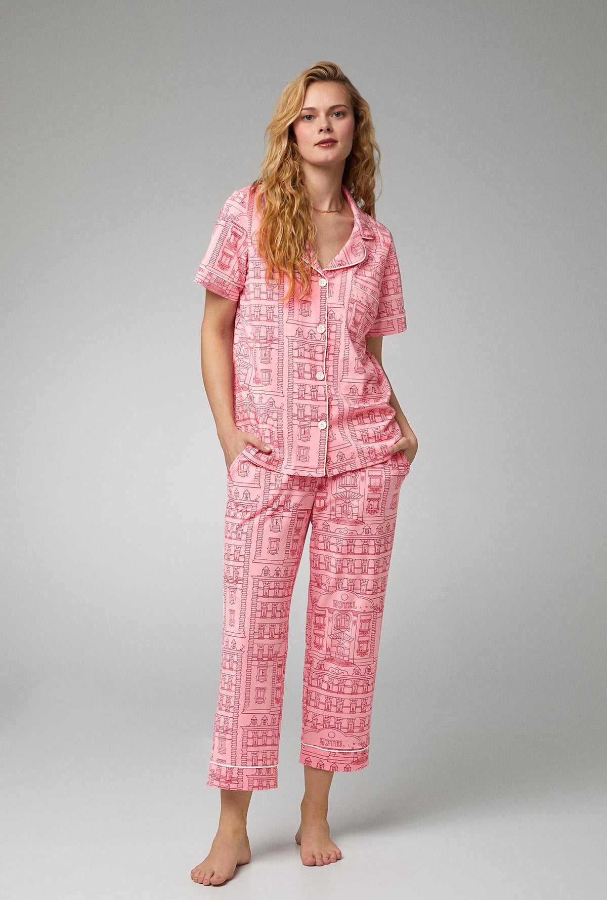 A lady wearing short sleeve classic stretch jersey cropped pj set with grand hotel print