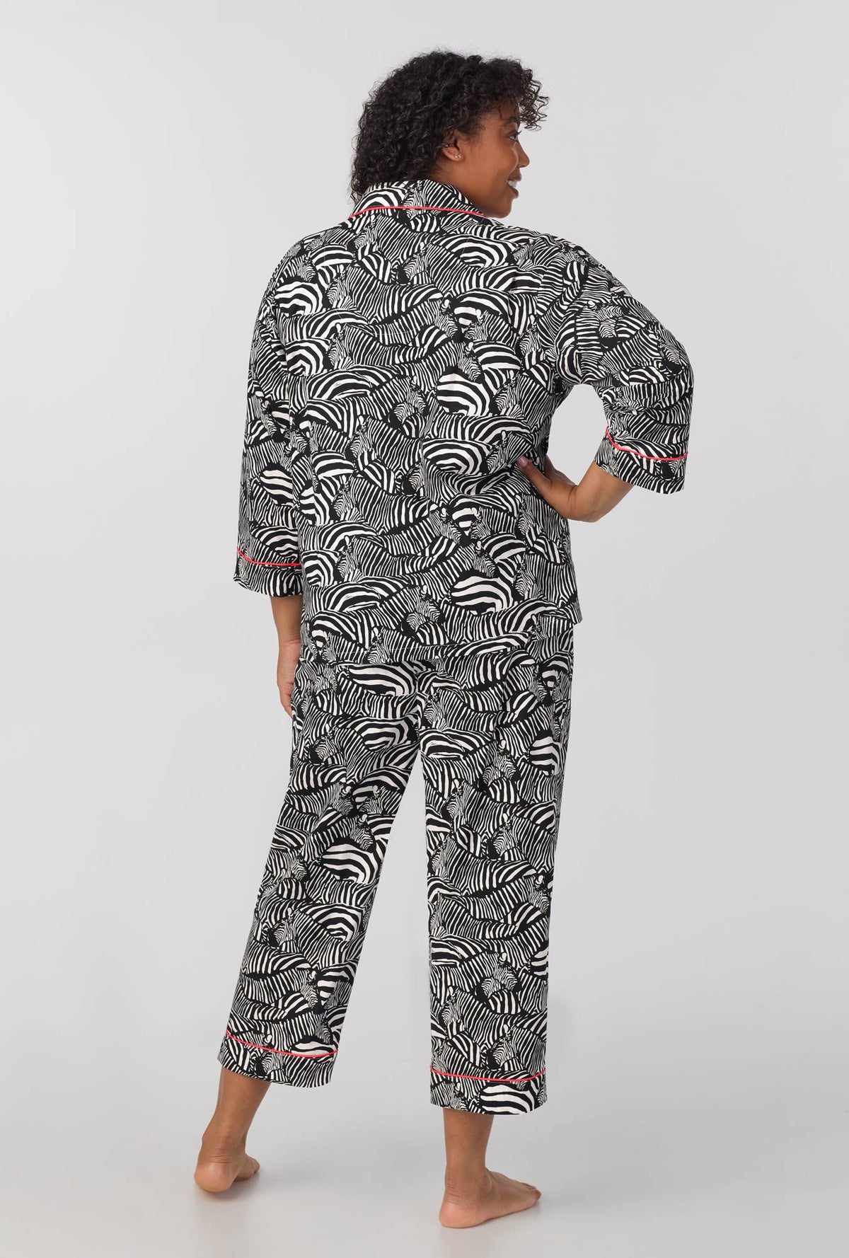 A lady wearing plus size  quarter Sleeve Classic Woven Cotton Cropped PJ Set with  Zebra Safari print