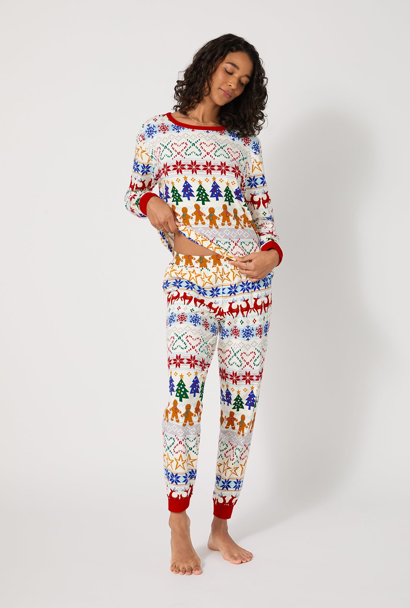 A lady wearing Deck The Halls Long Sleeve Pullover Crew And Jogger Stretch Jersey Pj Set