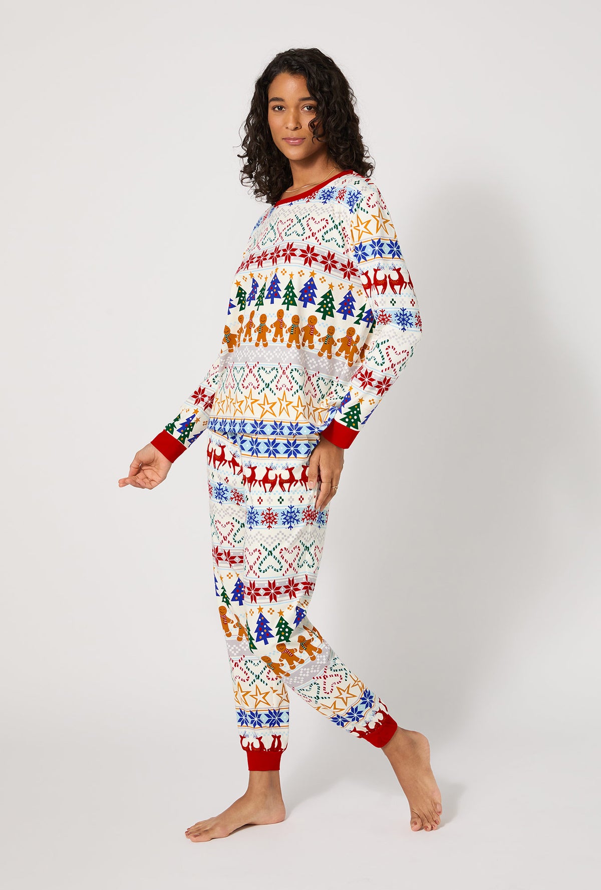 A lady wearing Deck The Halls Long Sleeve Pullover Crew And Jogger Stretch Jersey Pj Set