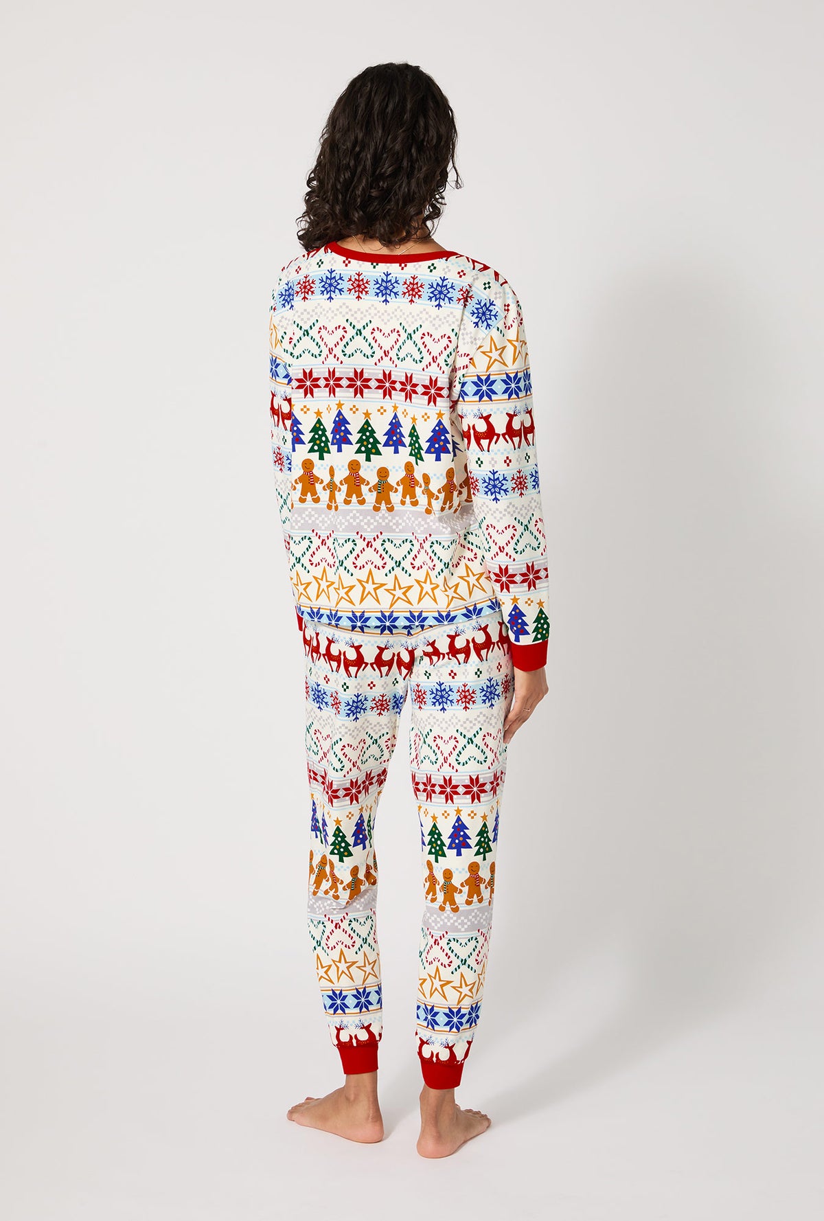 A lady wearing Deck The Halls Long Sleeve Pullover Crew And Jogger Stretch Jersey Pj Set