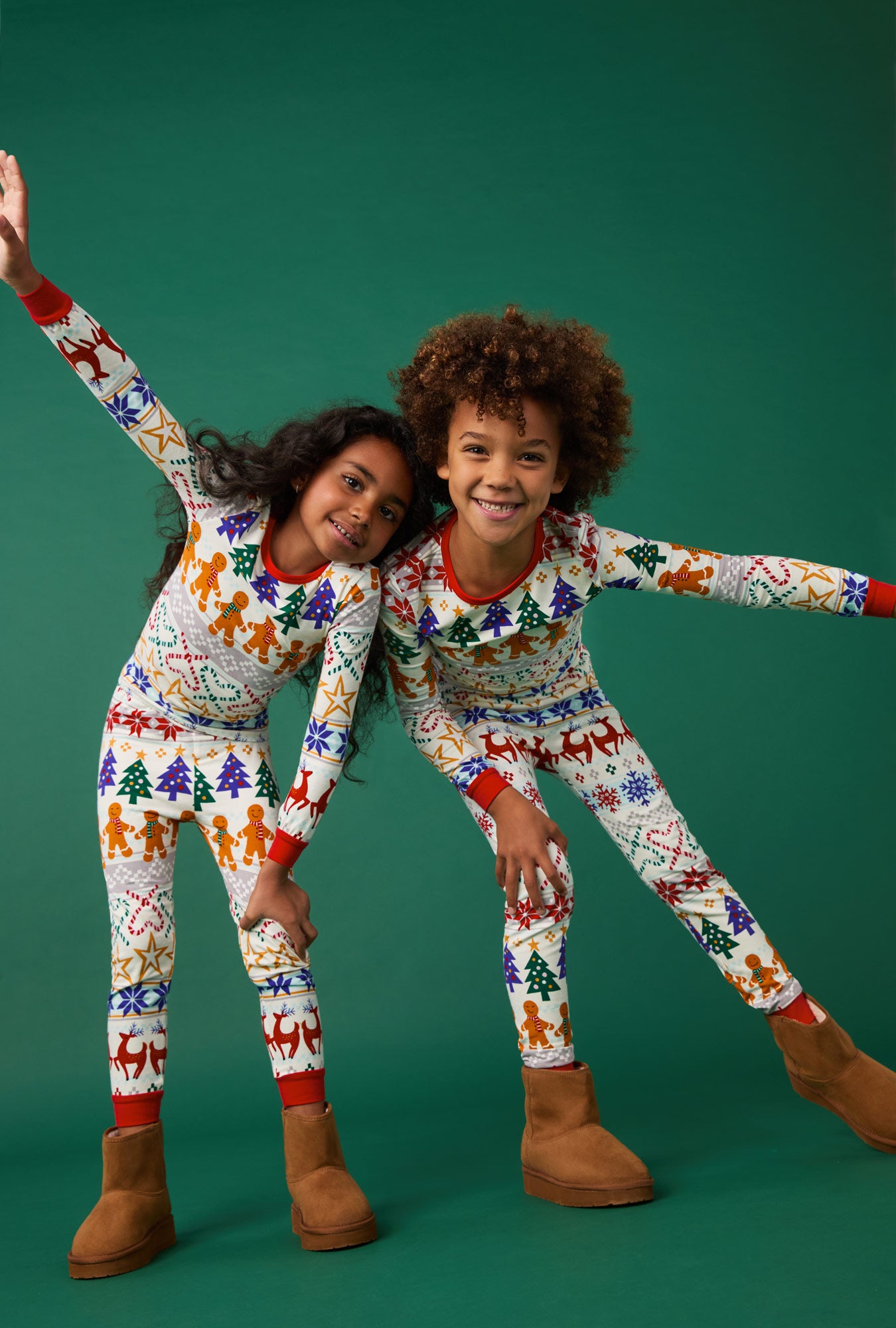 A girl and a boy wearing Deck The Halls Long Sleeve Stretch Jersey Kids Pj Set