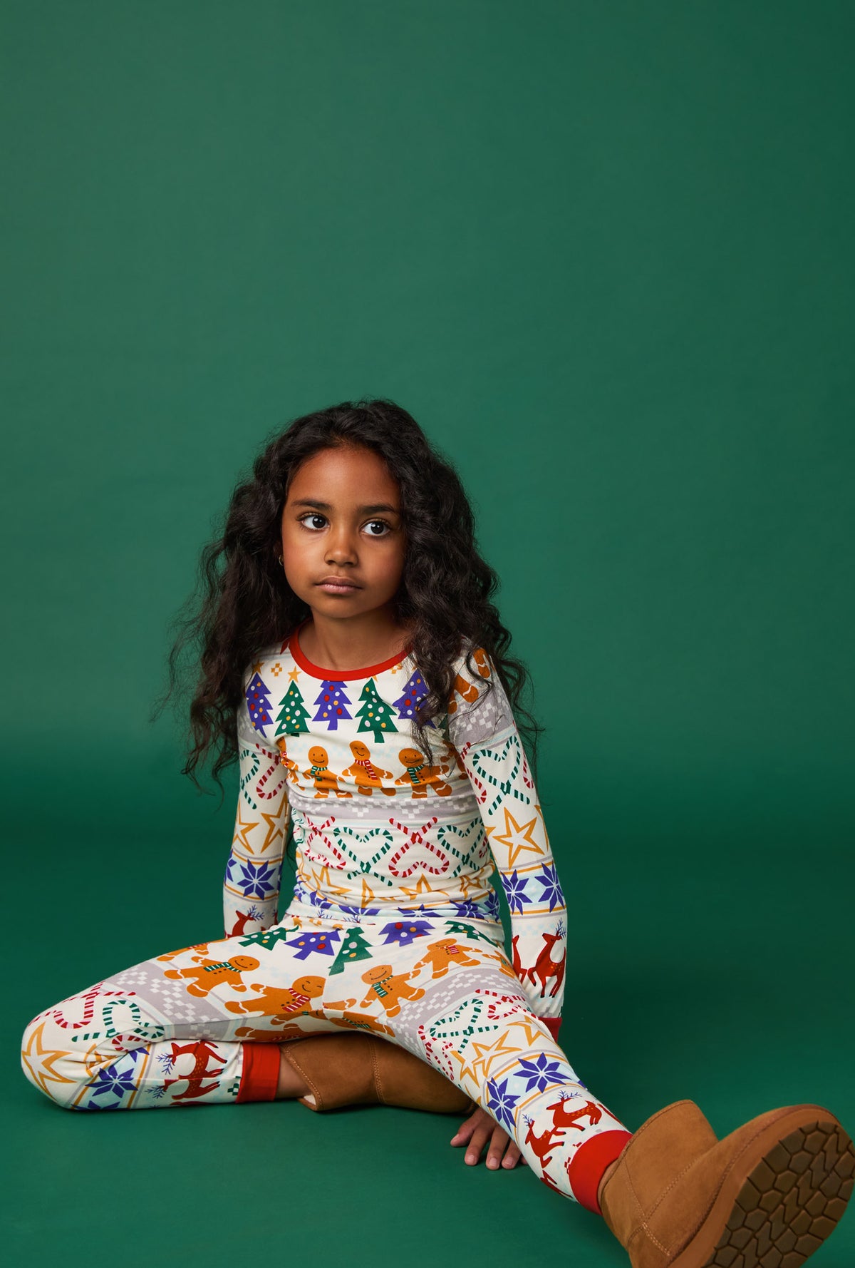 A girl wearing Deck The Halls Long Sleeve Stretch Jersey Kids Pj Set