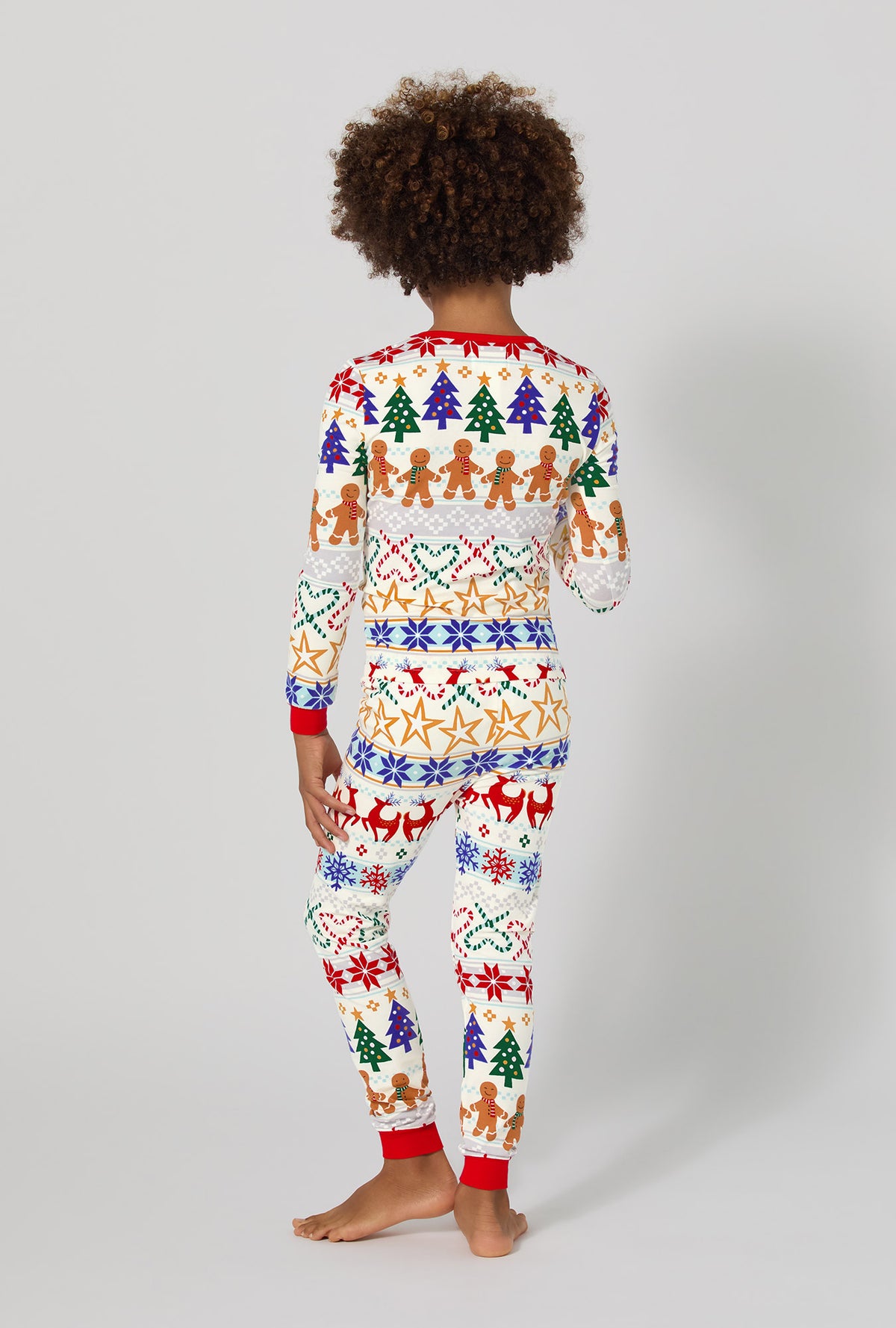A boy wearing Deck The Halls Long Sleeve Stretch Jersey Kids Pj Set