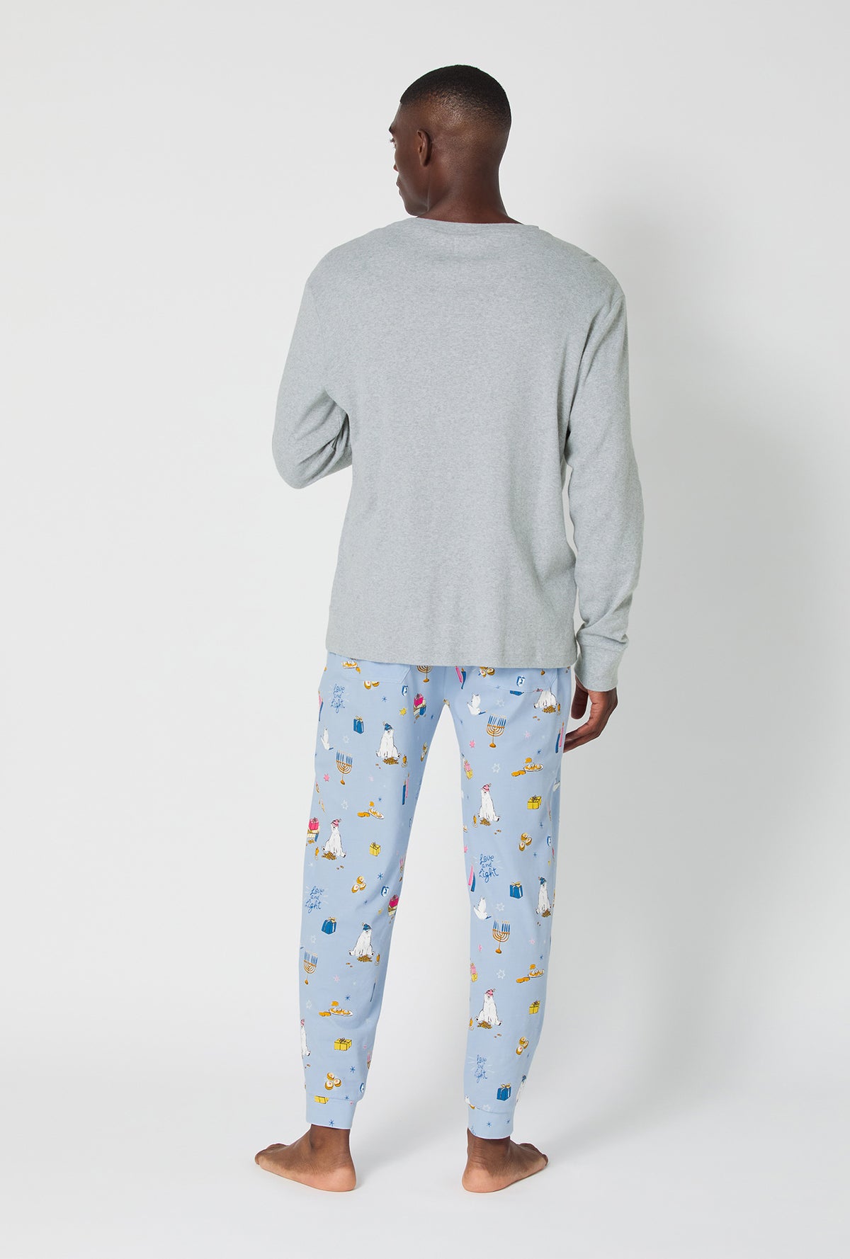 A man wearing Love And Light Men&#39;s Long Sleeve Henley And Jogger Stretch Jersey Pj Set