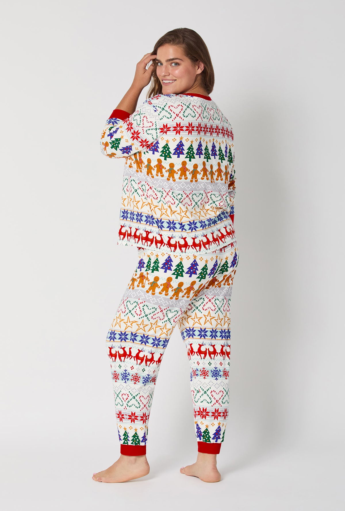 A lady wearing Deck The Halls Long Sleeve Pullover Crew And Jogger Stretch Jersey Pj Set