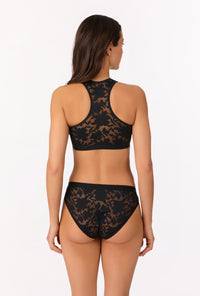A lady wearing Black Stretch Lace Racerback Tank Bra
