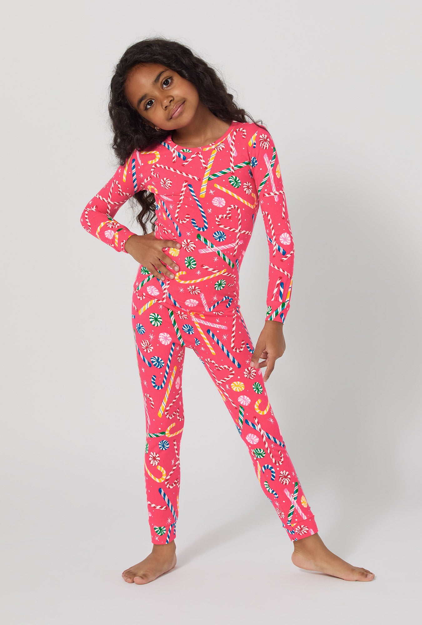 A girl wearing Peppermint Twist Long Sleeve Stretch Jersey Kids Pj Set