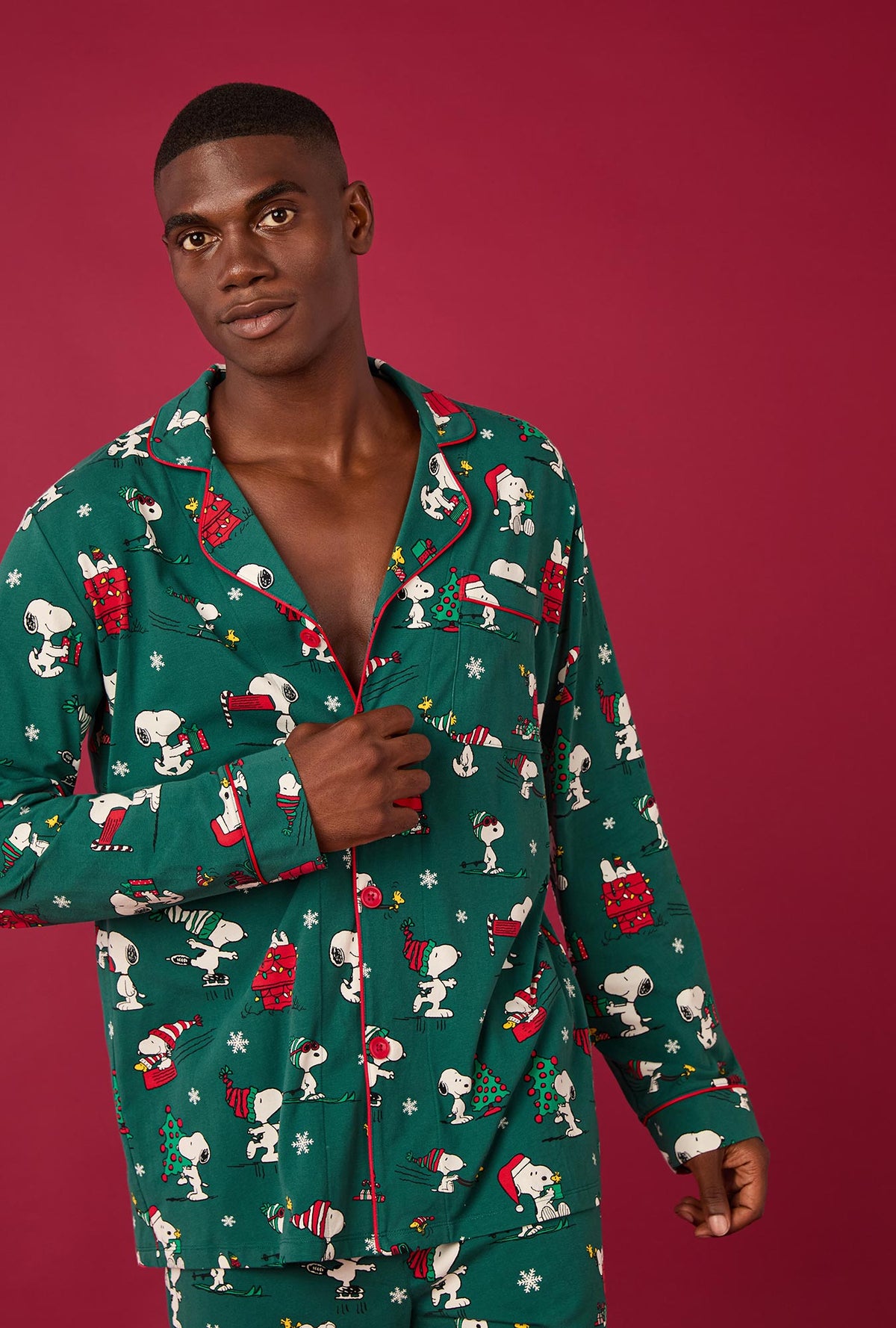 A man wearing ®Snoopy&#39;s Holiday Fun Men&#39;s Long Sleeve Classic Stretch Jersey Pj Set