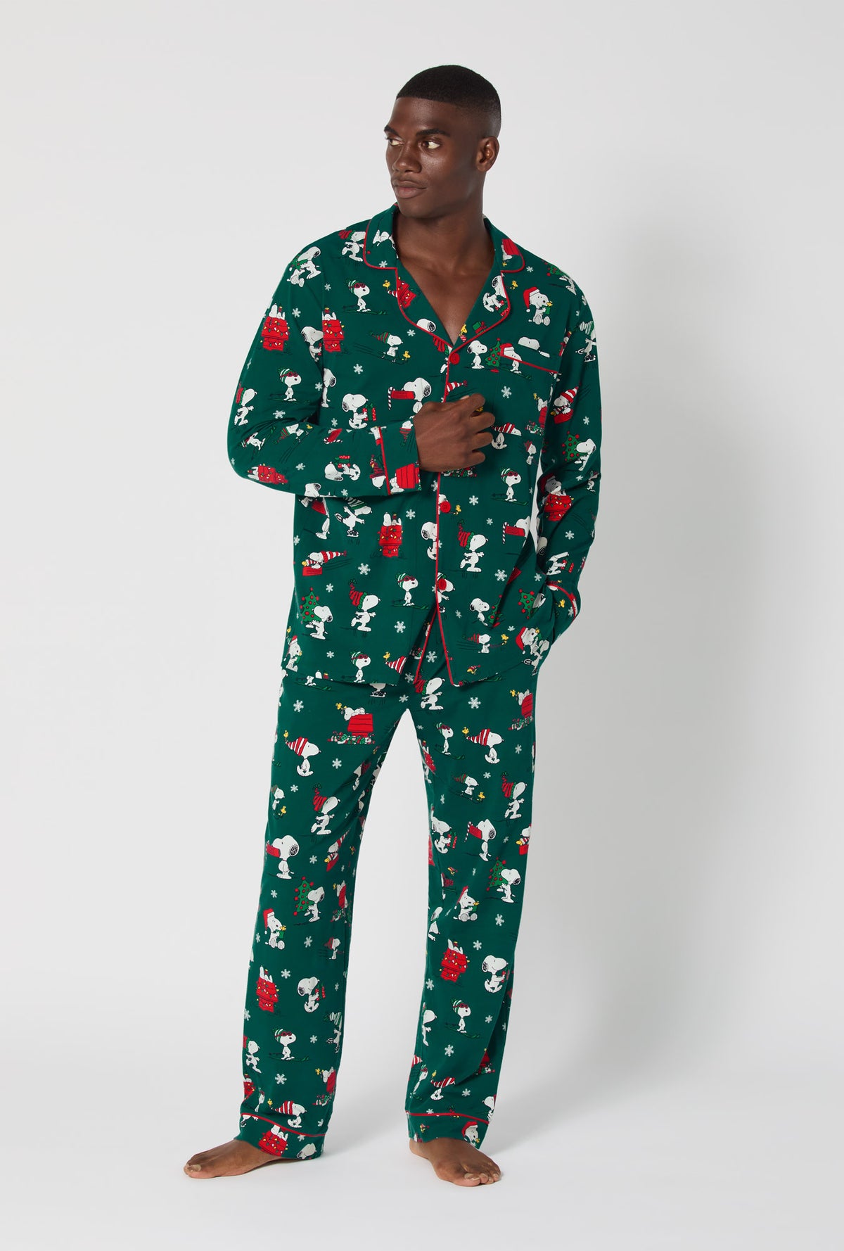 A man wearing ®Snoopy&#39;s Holiday Fun Men&#39;s Long Sleeve Classic Stretch Jersey Pj Set