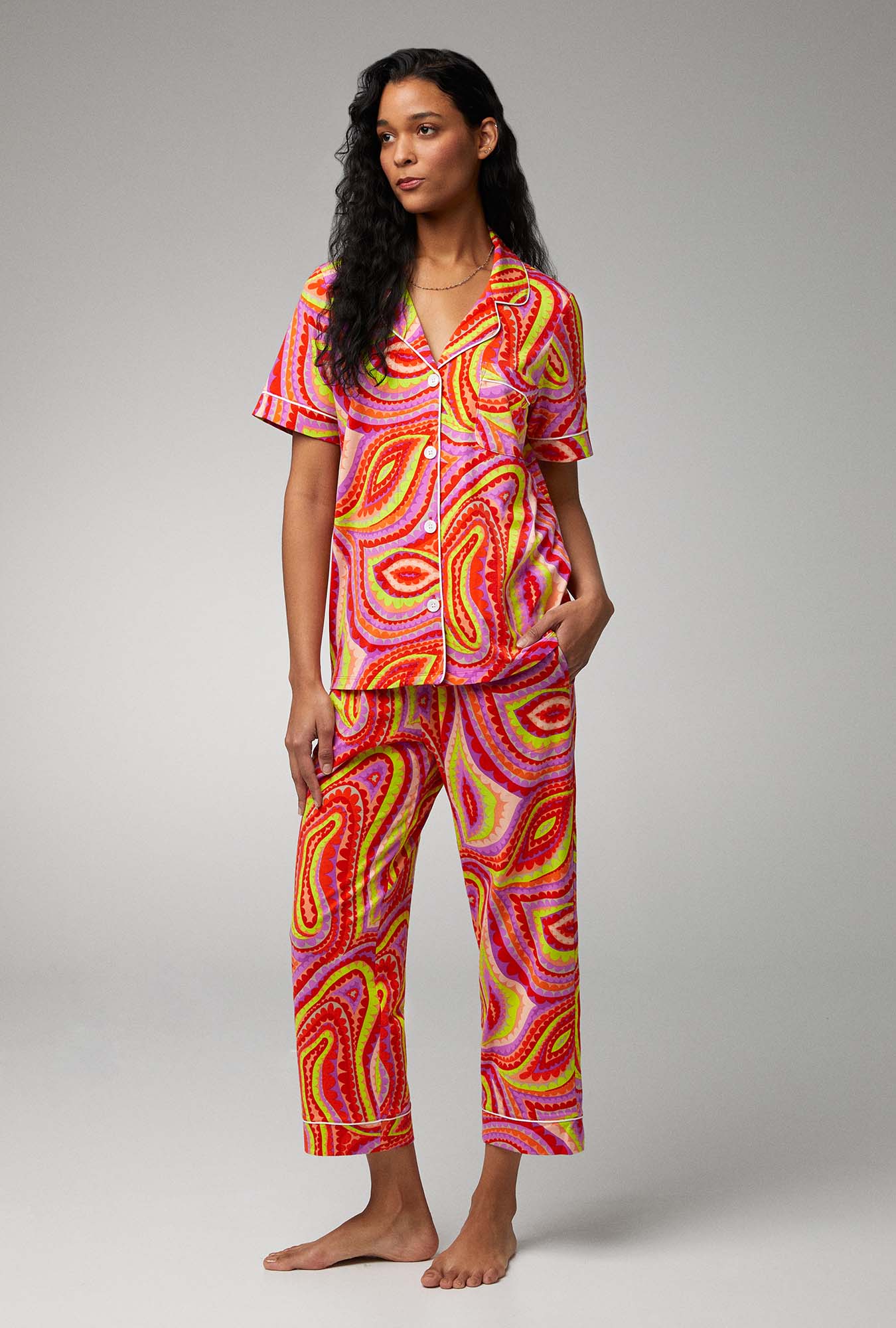 A lady wearing short sleeve cropped pj set with vivacious.