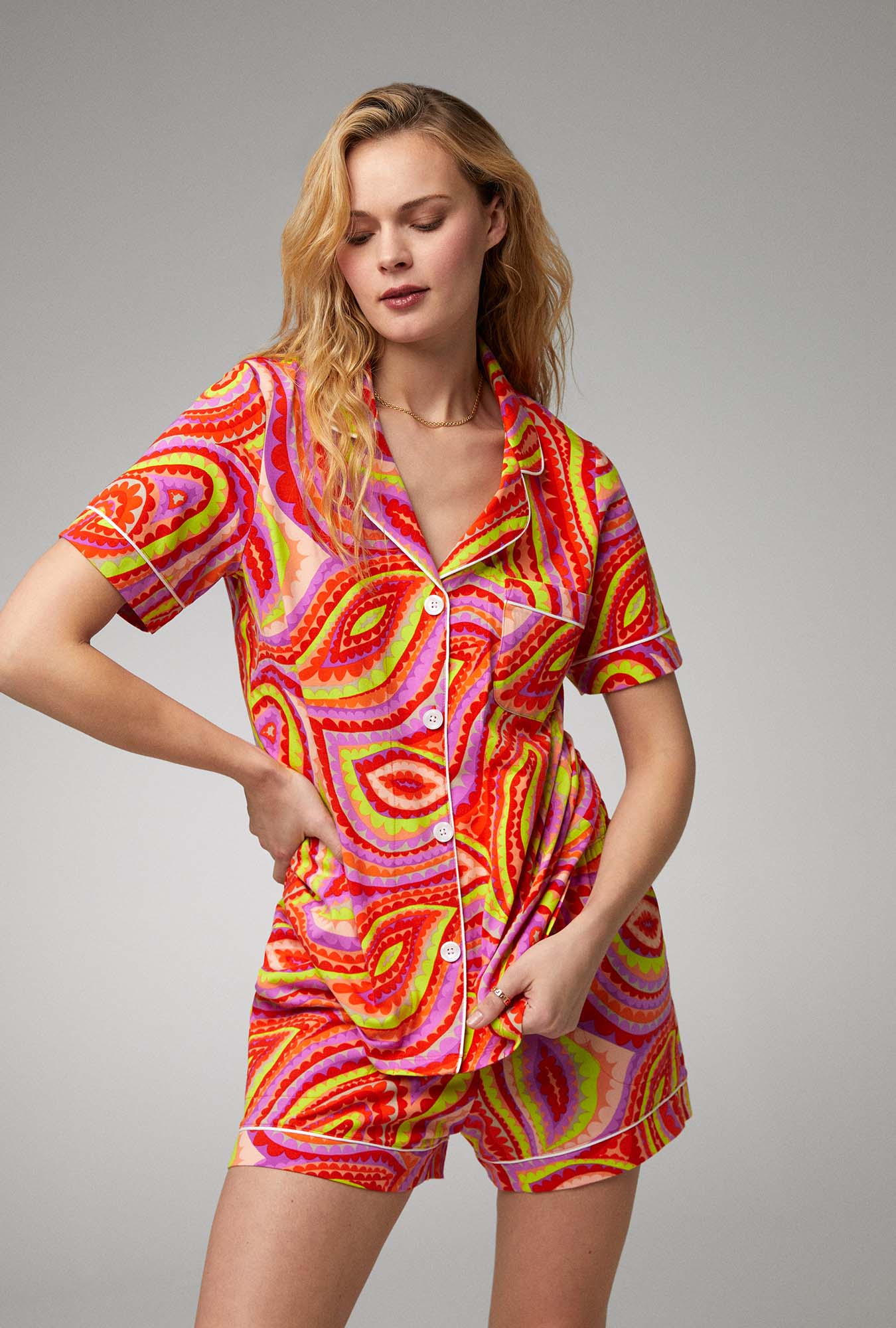 A lady wearing multi color short sleeve stretch jersey shorty pj set with vivacious.