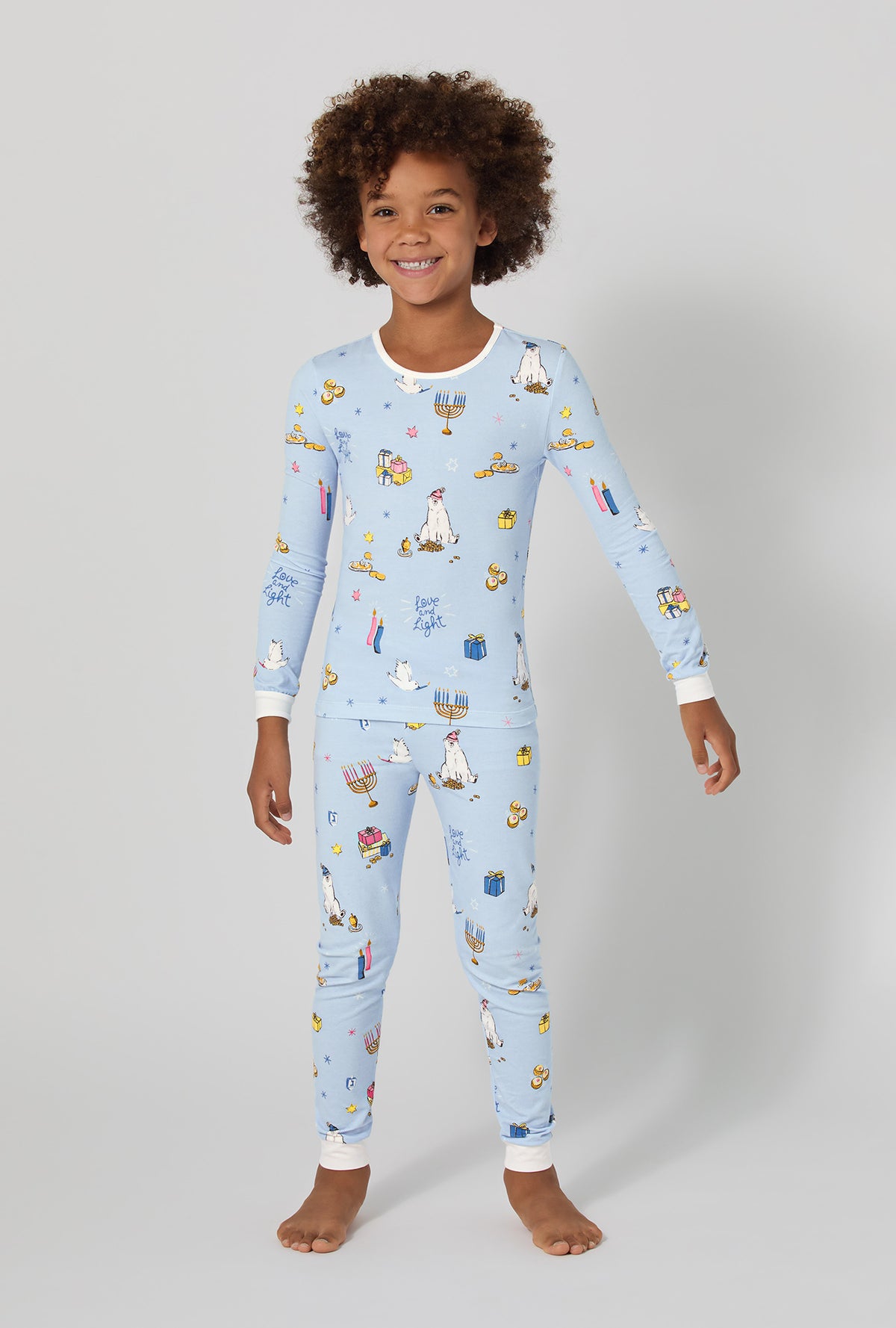 A girl wearing Love And Light Long Sleeve Stretch Jersey Kids Pj Set
