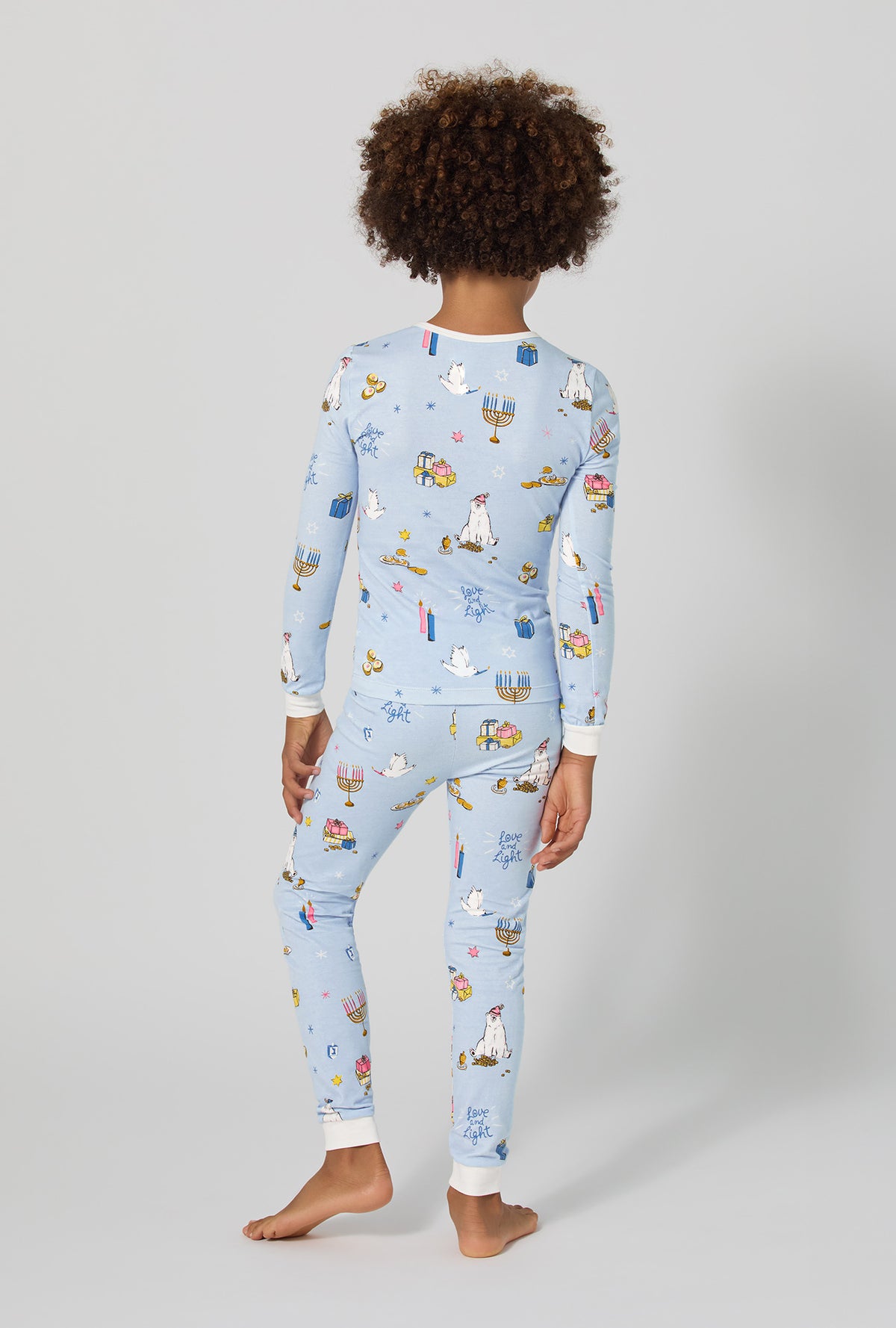 A girl wearing Love And Light Long Sleeve Stretch Jersey Kids Pj Set