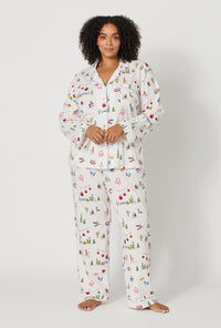 A lady wearing plus size Snow Much Fun Long Sleeve Classic Stretch Jersey Pj Set
