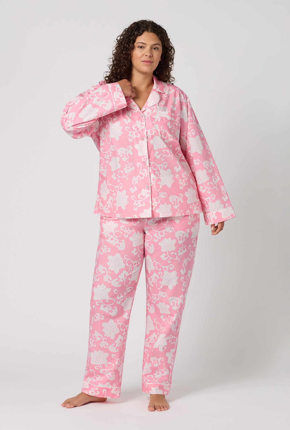 A Lady Wearing Plus Size Dynasty Pink Long Sleeve Classic Woven Cotton Poplin Pj Set in a front view pose
