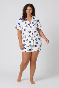 A Lady Wearing Plus Size Eyeconic Short Sleeve Classic Shorty Stretch Jersey Pj Set