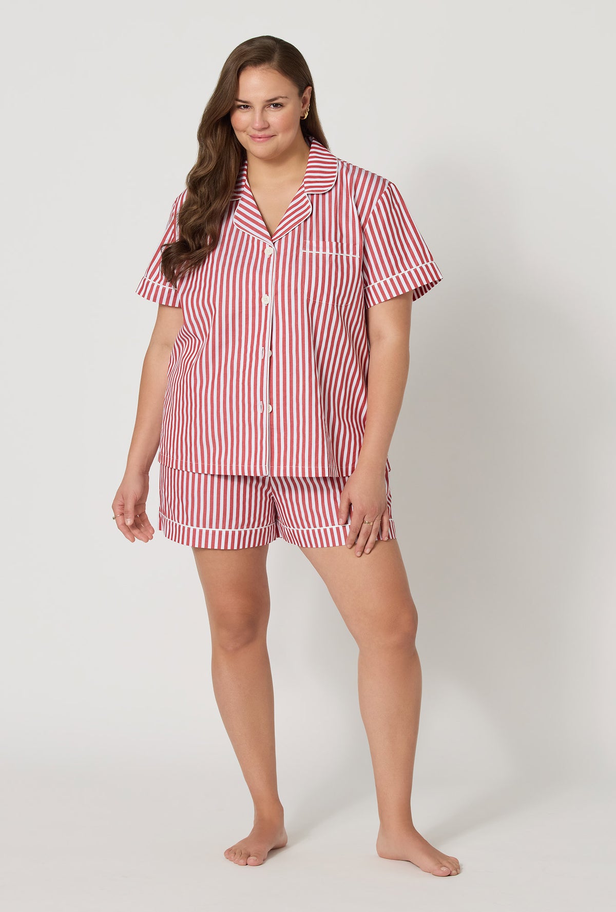 A lady wearing plus size Red Signature Stripe Short Sleeve Classic Woven Cotton Sateen Shorty Pj Set